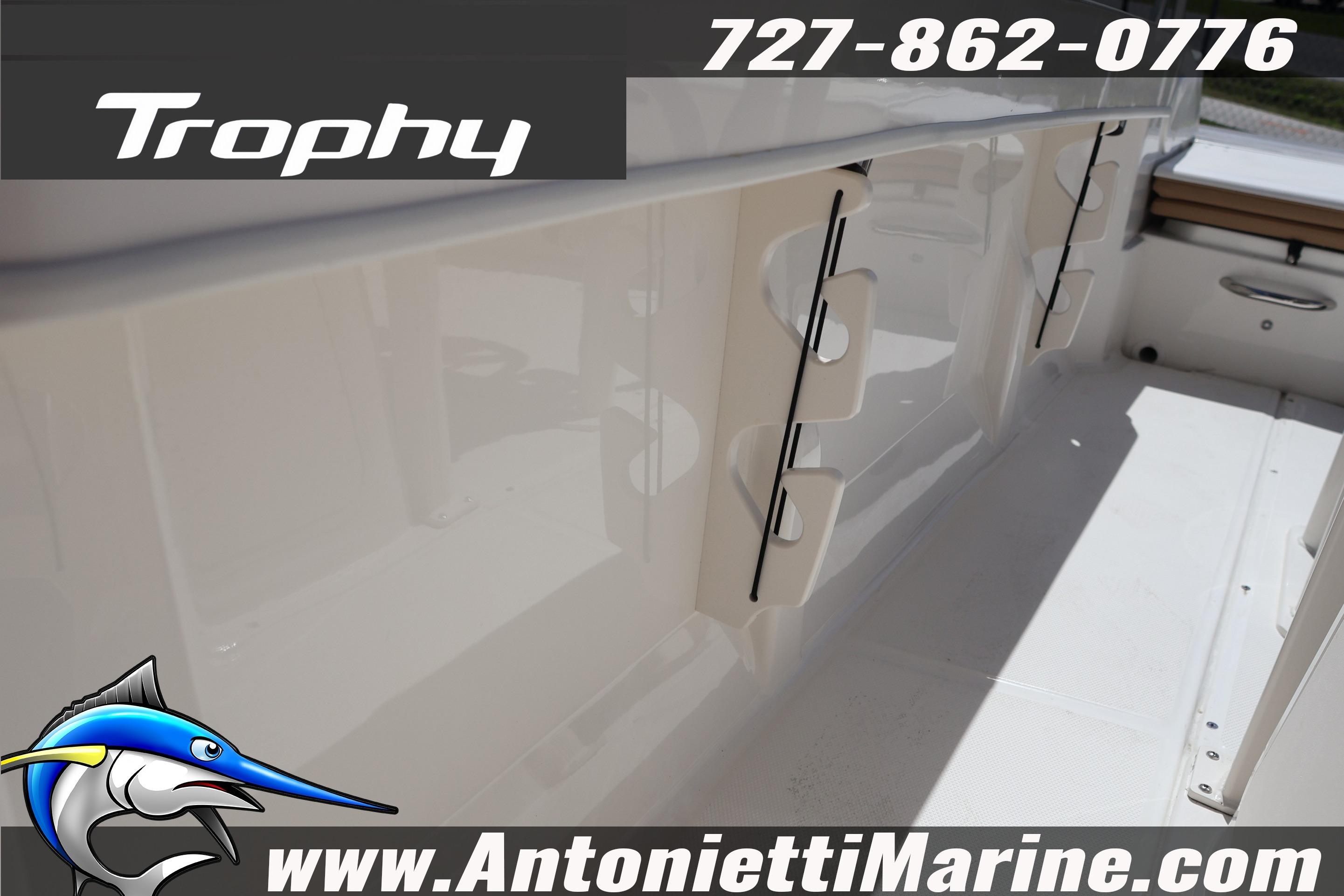 2026 Bayliner Trophy T20CC boat interior with rod holders, contact details, and logo.