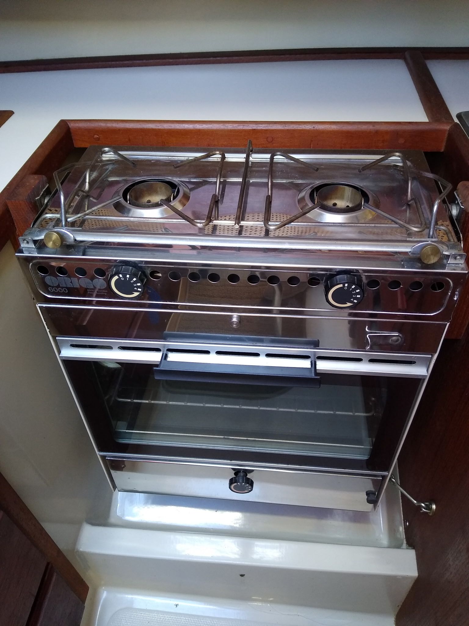 Compact stove inside a 1986 Laguna 30 boat.