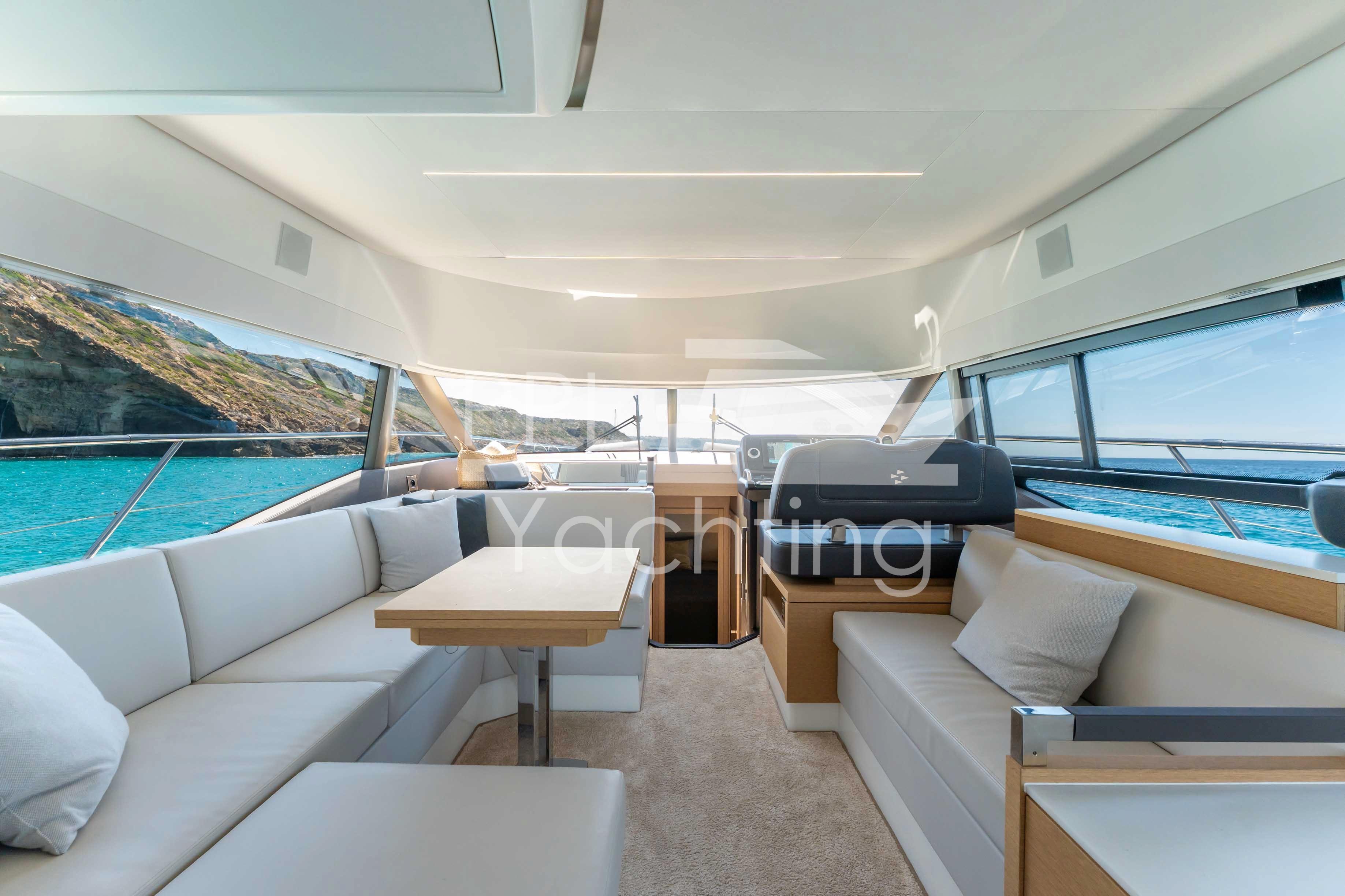 Luxurious interior of 2019 Prestige 460 yacht with scenic ocean view.