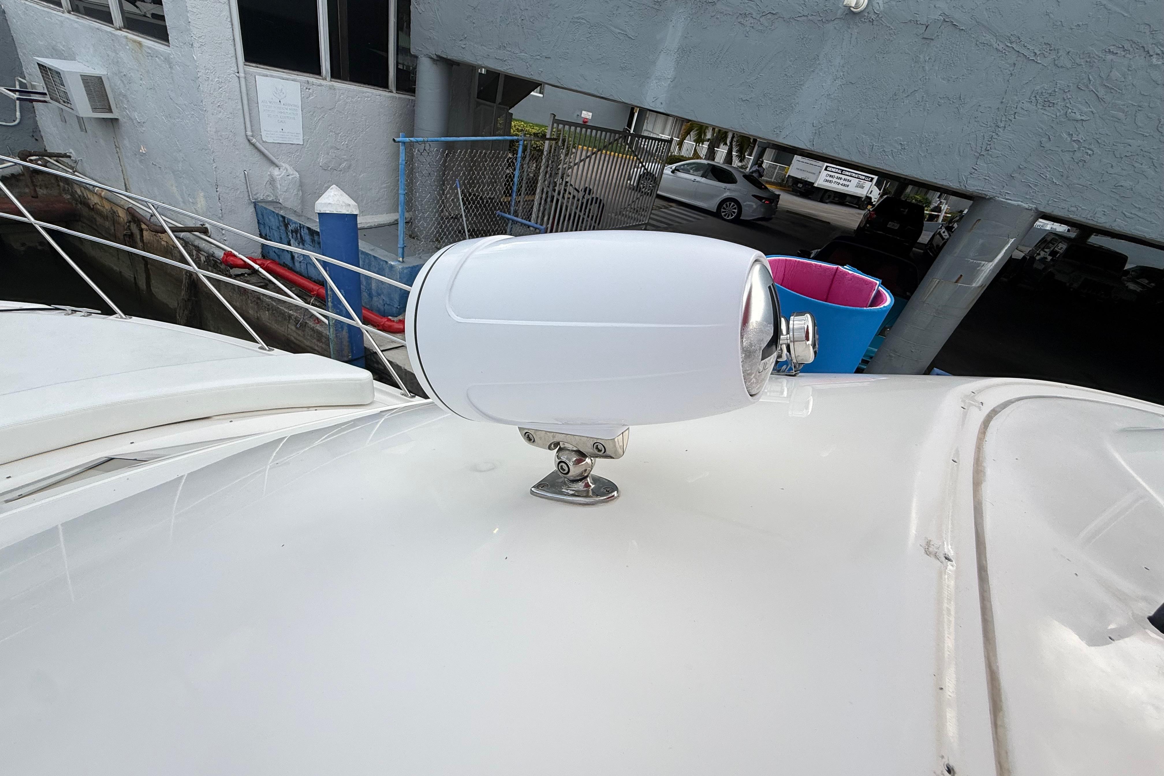 Spotlight on 2007 Meridian 459 Motoryacht deck, docked at marina.