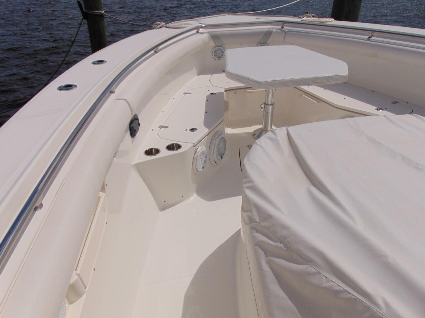 2013 Boston Whaler 370 Outrage boat interior with seating and table.