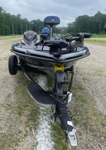 2025 Ranger Z520R boat on trailer, parked outdoors, with lush greenery in the background.