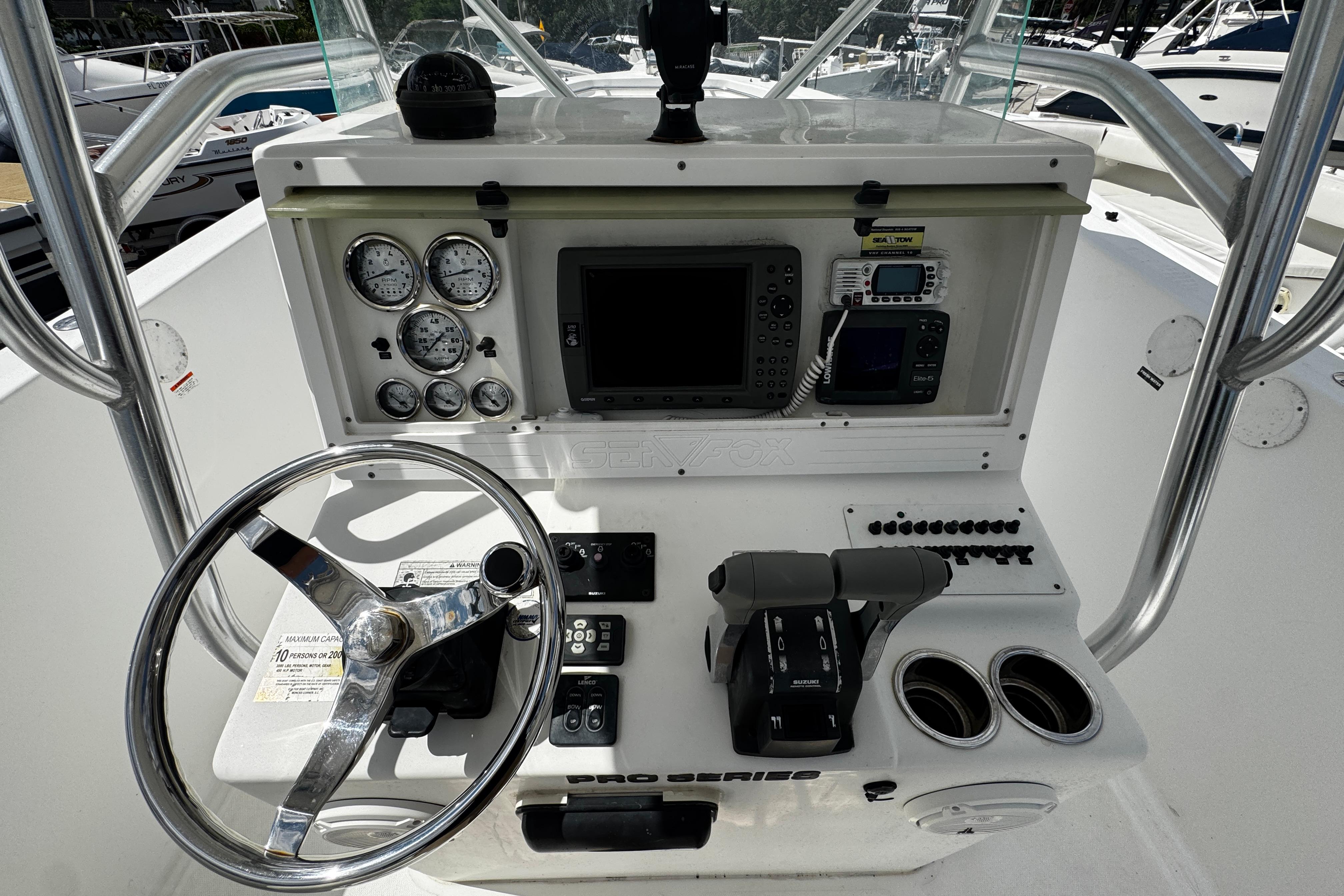 2008 Sea Fox 287 CC boat dashboard with steering wheel, gauges, and navigation equipment.
