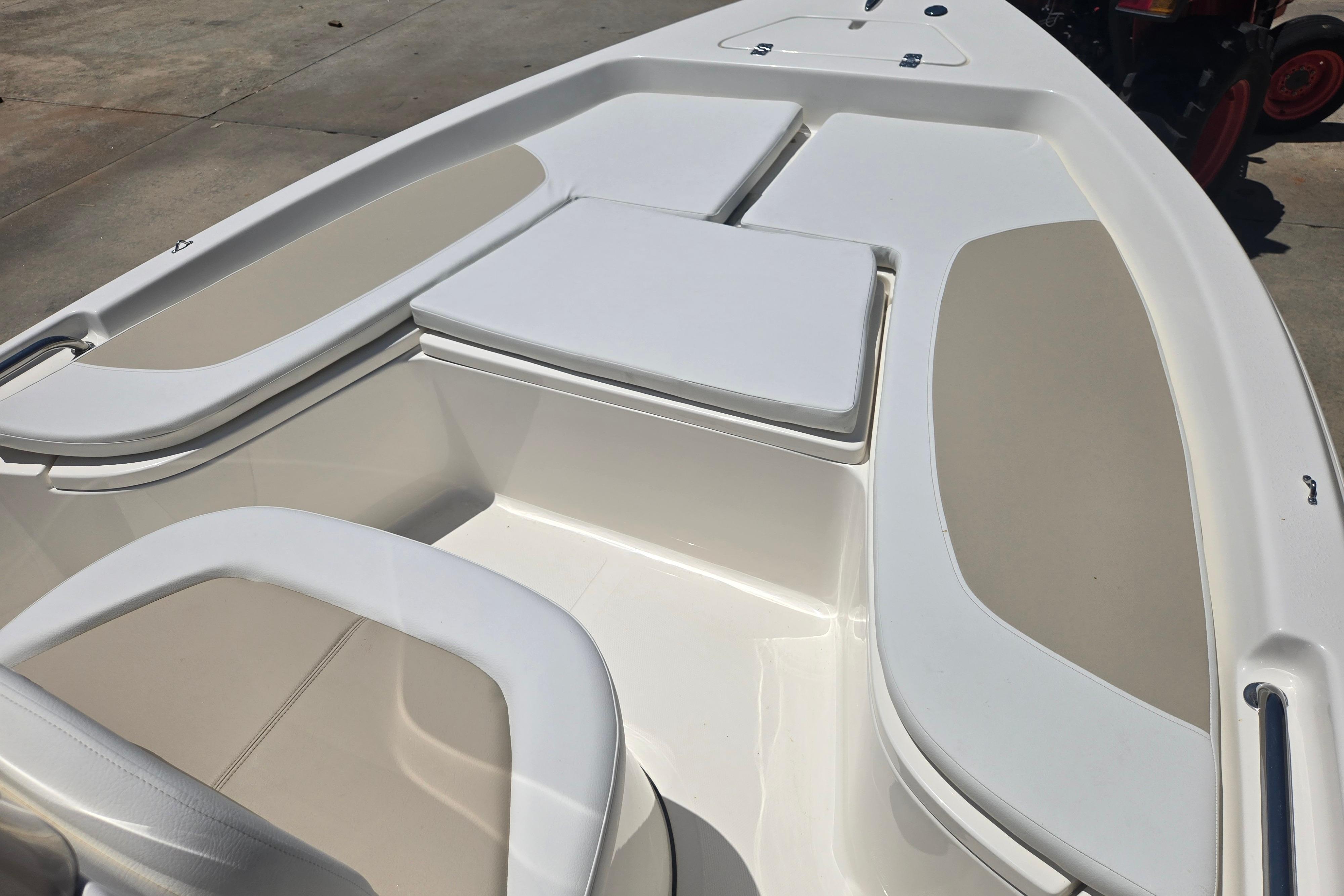 2026 Bulls Bay 2000 boat interior with cushioned seating and storage compartments.