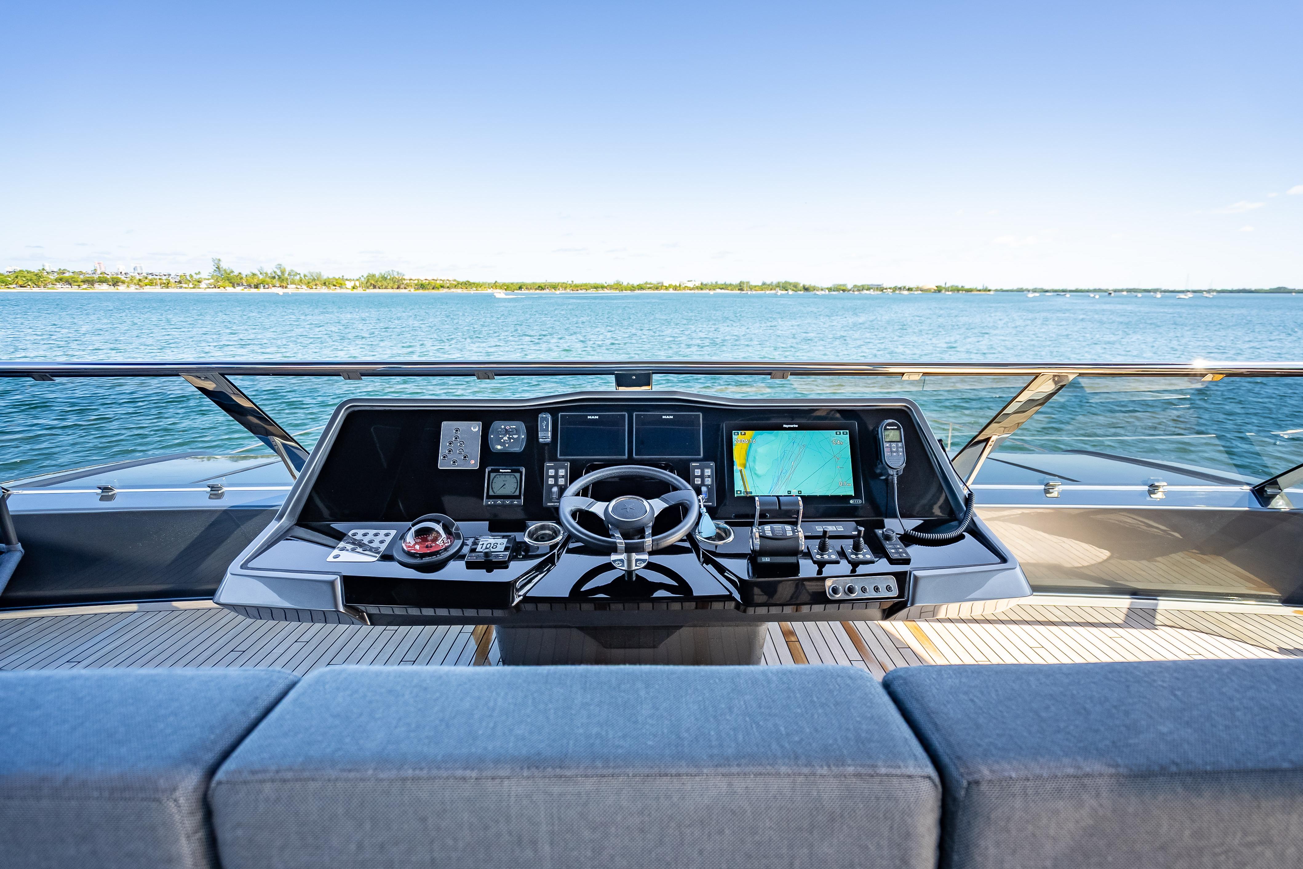 Helm of 2026 Sunreef 60 Power yacht with navigation controls and ocean view.