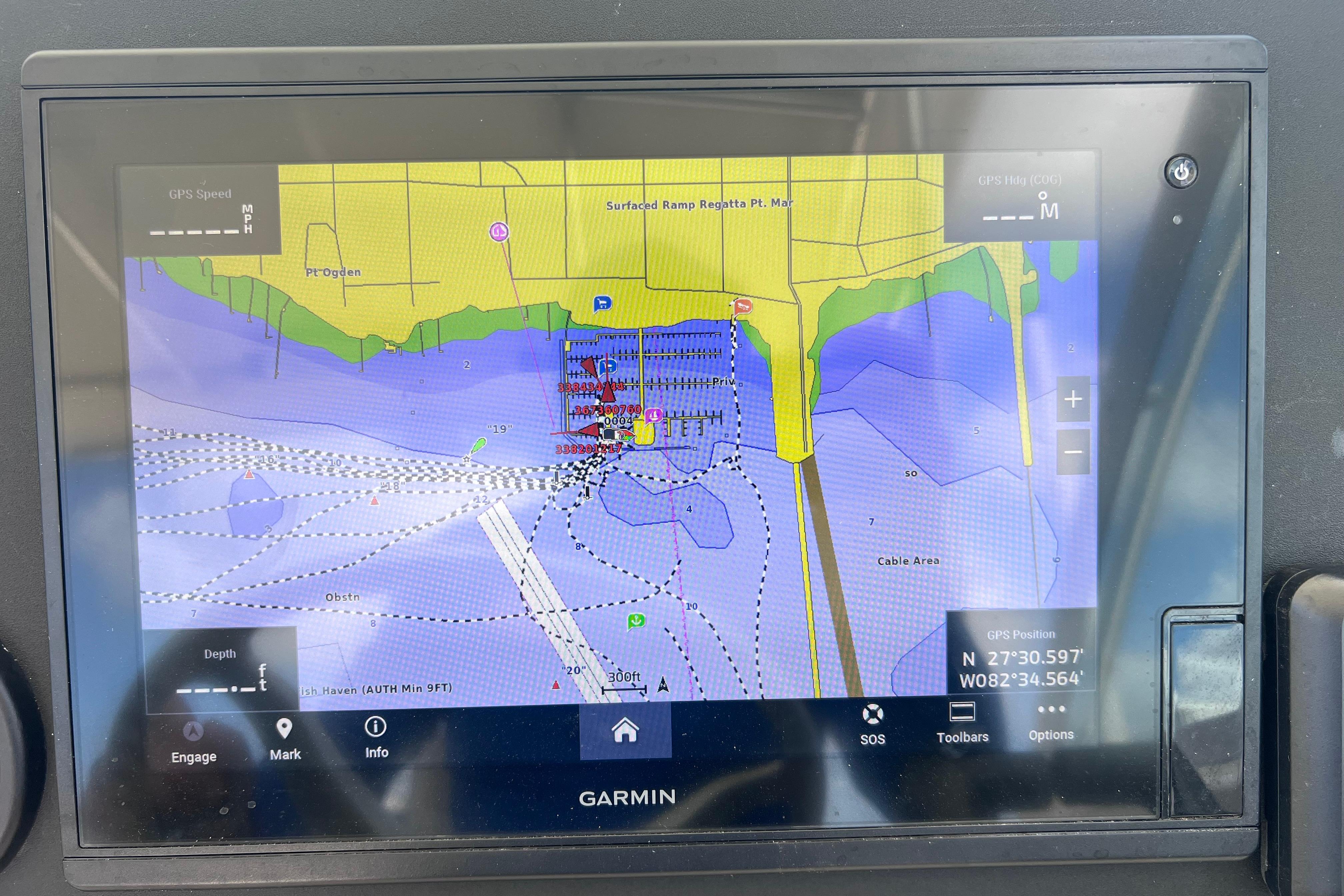 Garmin GPS display on 2004 Pursuit 2870 Walkaround showing nautical map and coordinates.