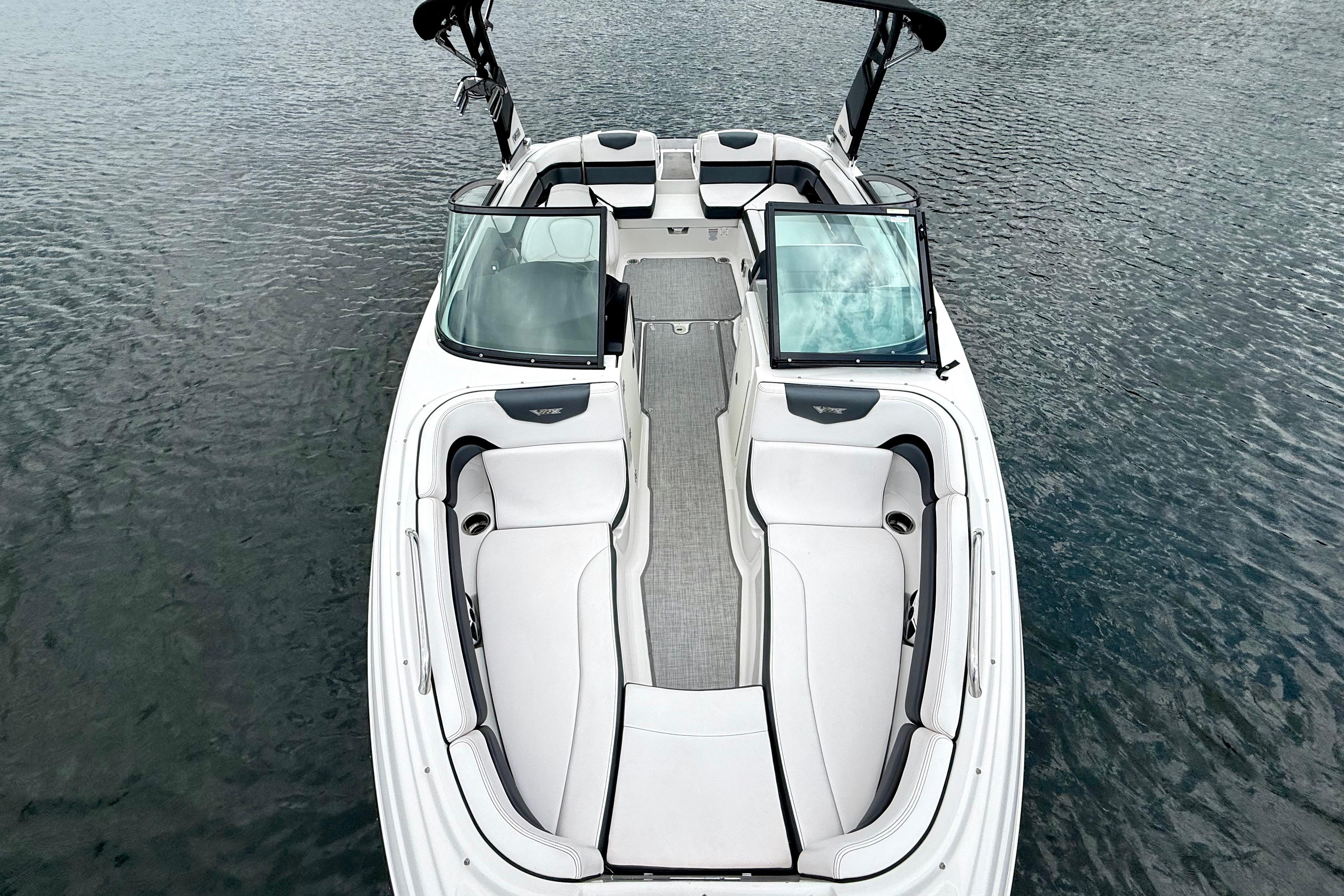 2019 Chaparral Vortex 223 VRX boat on water, featuring sleek interior design.