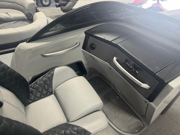 2025 Manitou LX boat interior with sleek black and gray seating.