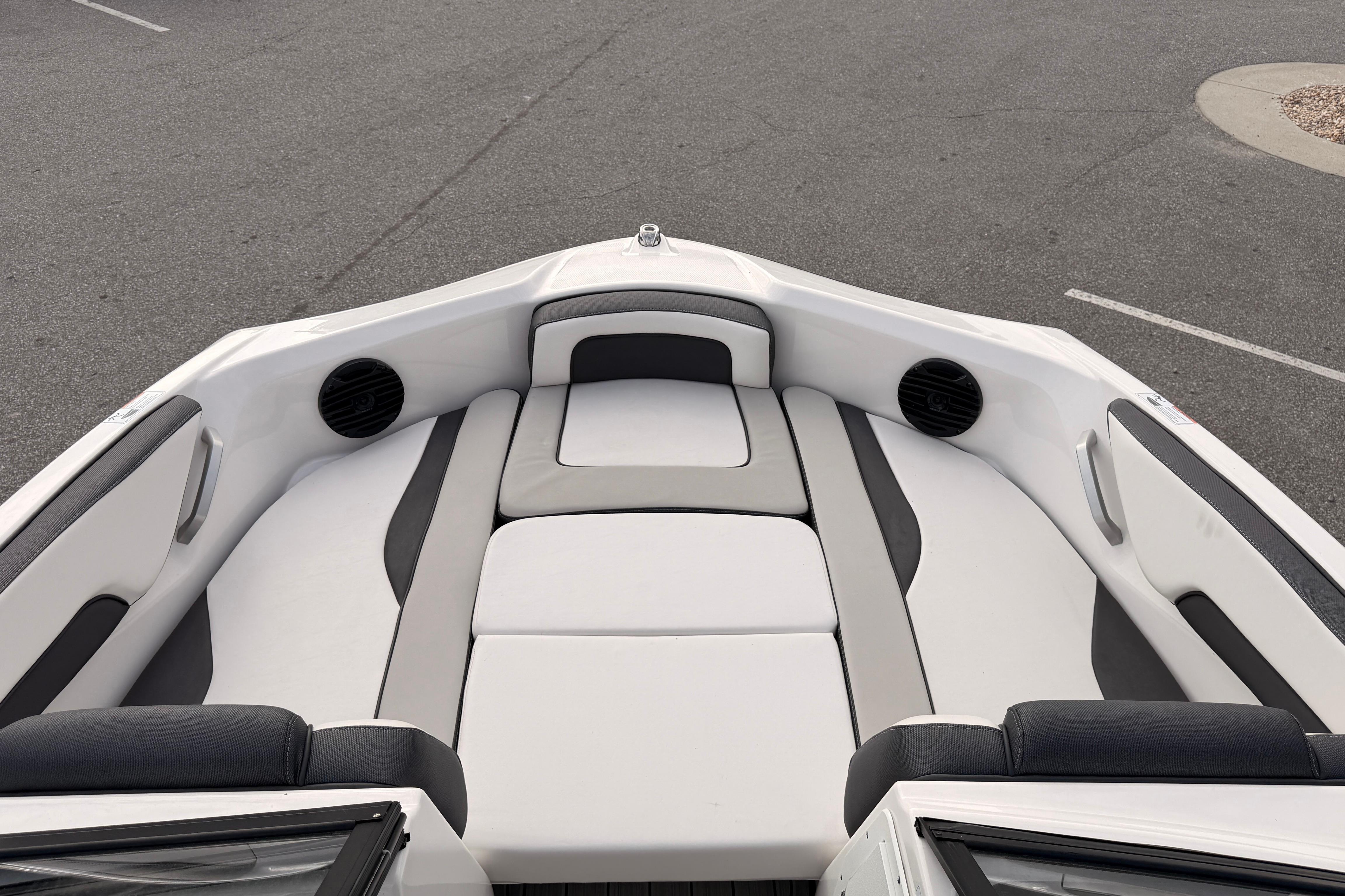 2023 Yamaha 195S boat interior with cushioned seating and speakers.