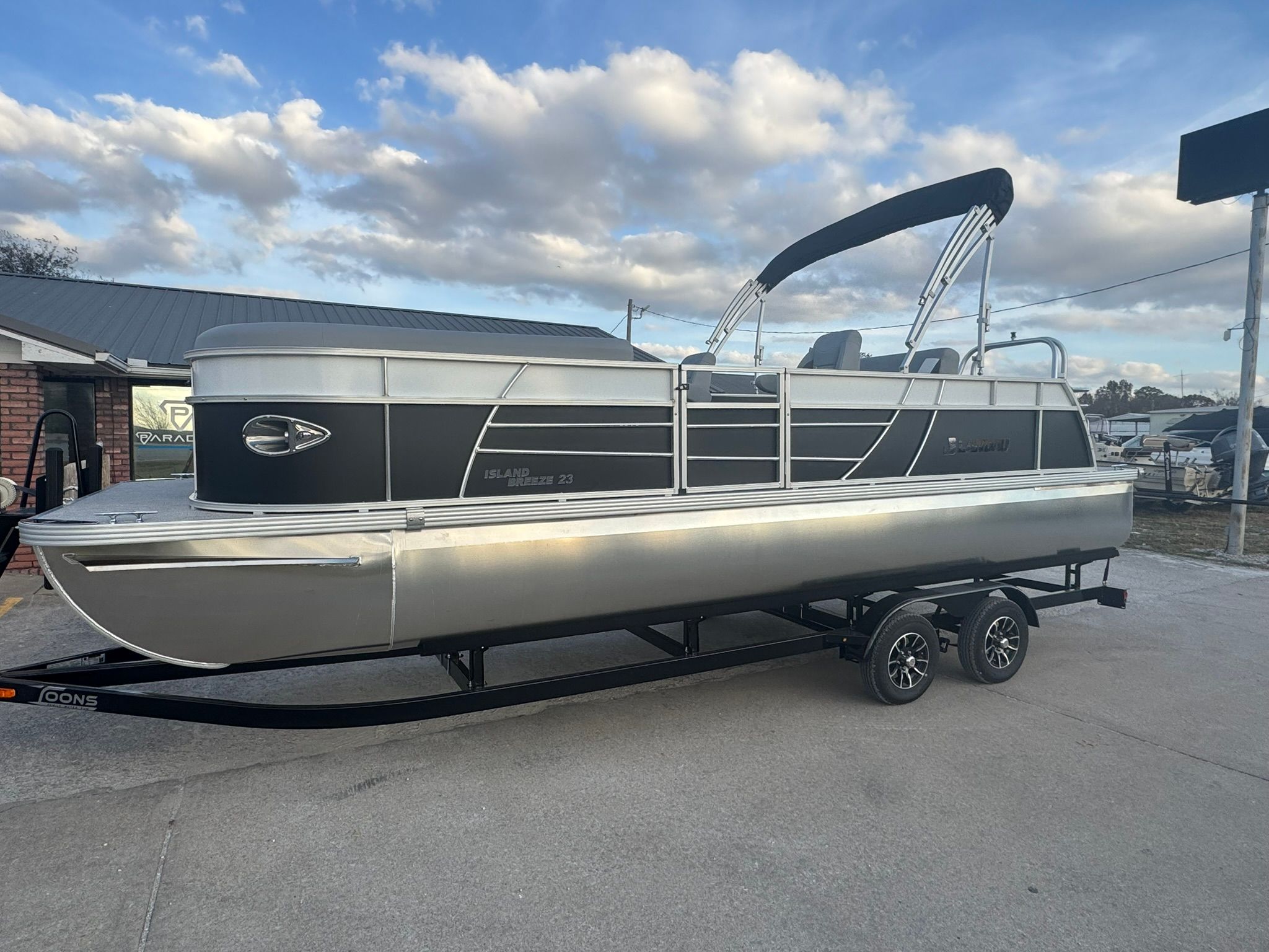 2026 Landau 23 Island Breeze pontoon boat on trailer.