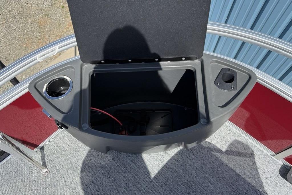 2026 Sun Tracker Bass Buggy 18 DLX storage compartment with cup holder and open lid.