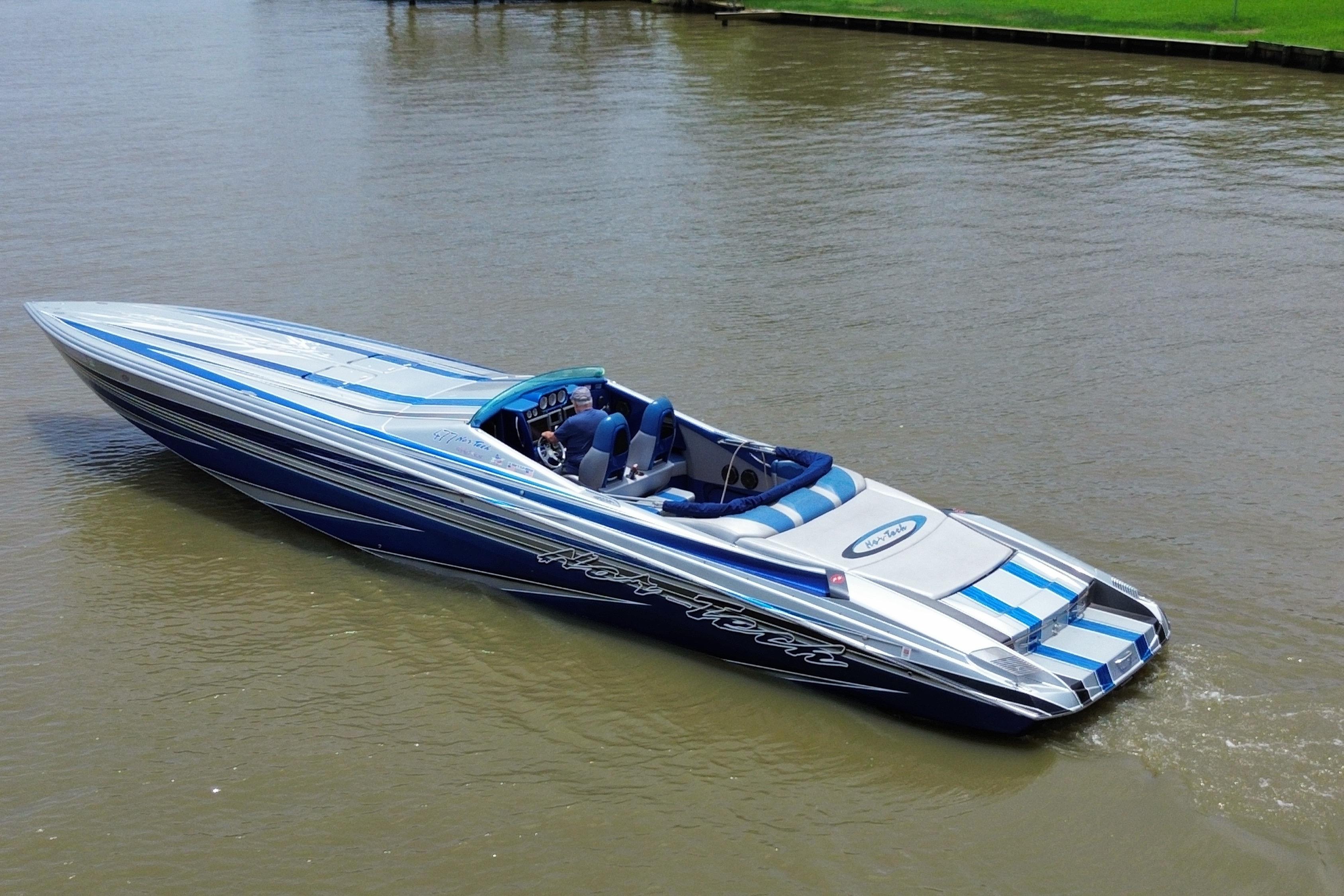 2013 Nor-Tech 477 SPX Vee Bottom boat cruising on calm water.