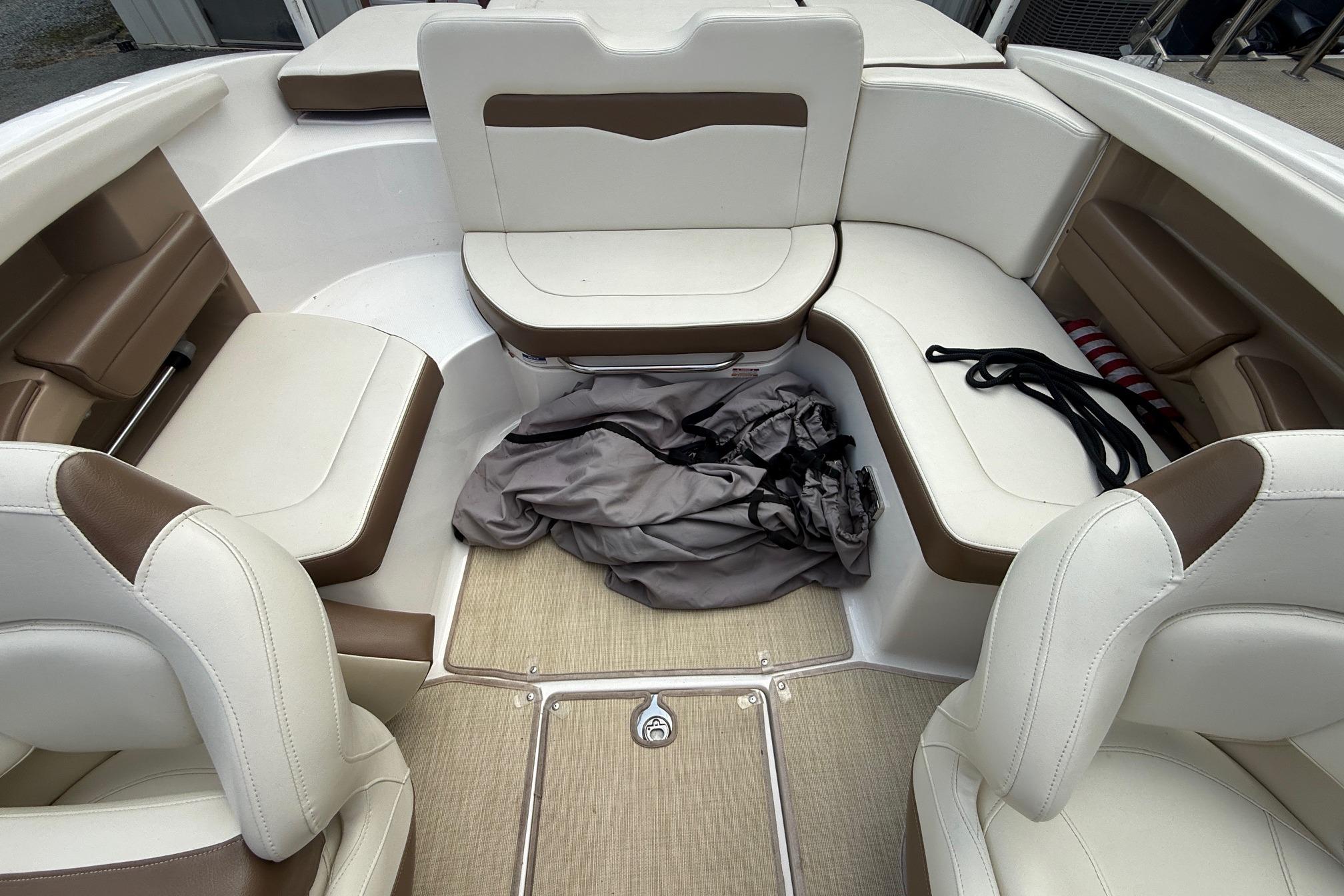 Interior of 2016 Chaparral 226 SSi Wide Tech boat with beige and brown seating.