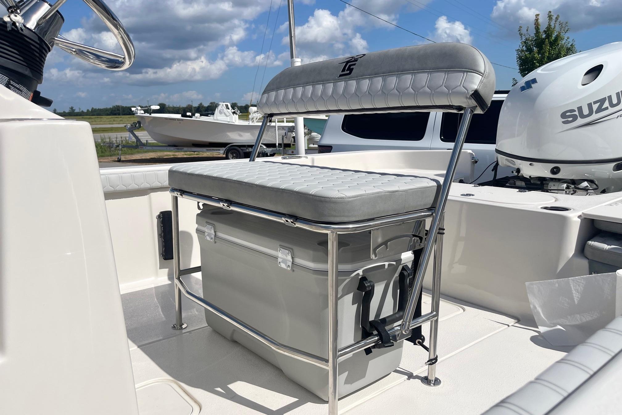 2026 Carolina Skiff 19 LS boat interior with seating and Suzuki outboard motor.