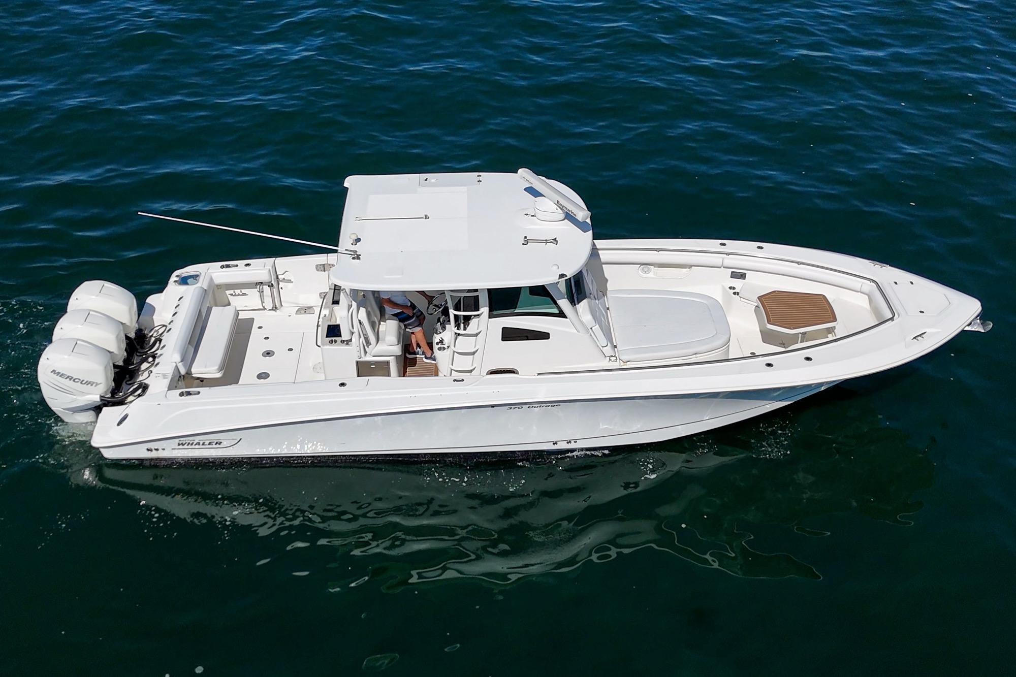 2015 Boston Whaler 370 Outrage boat cruising on open water.