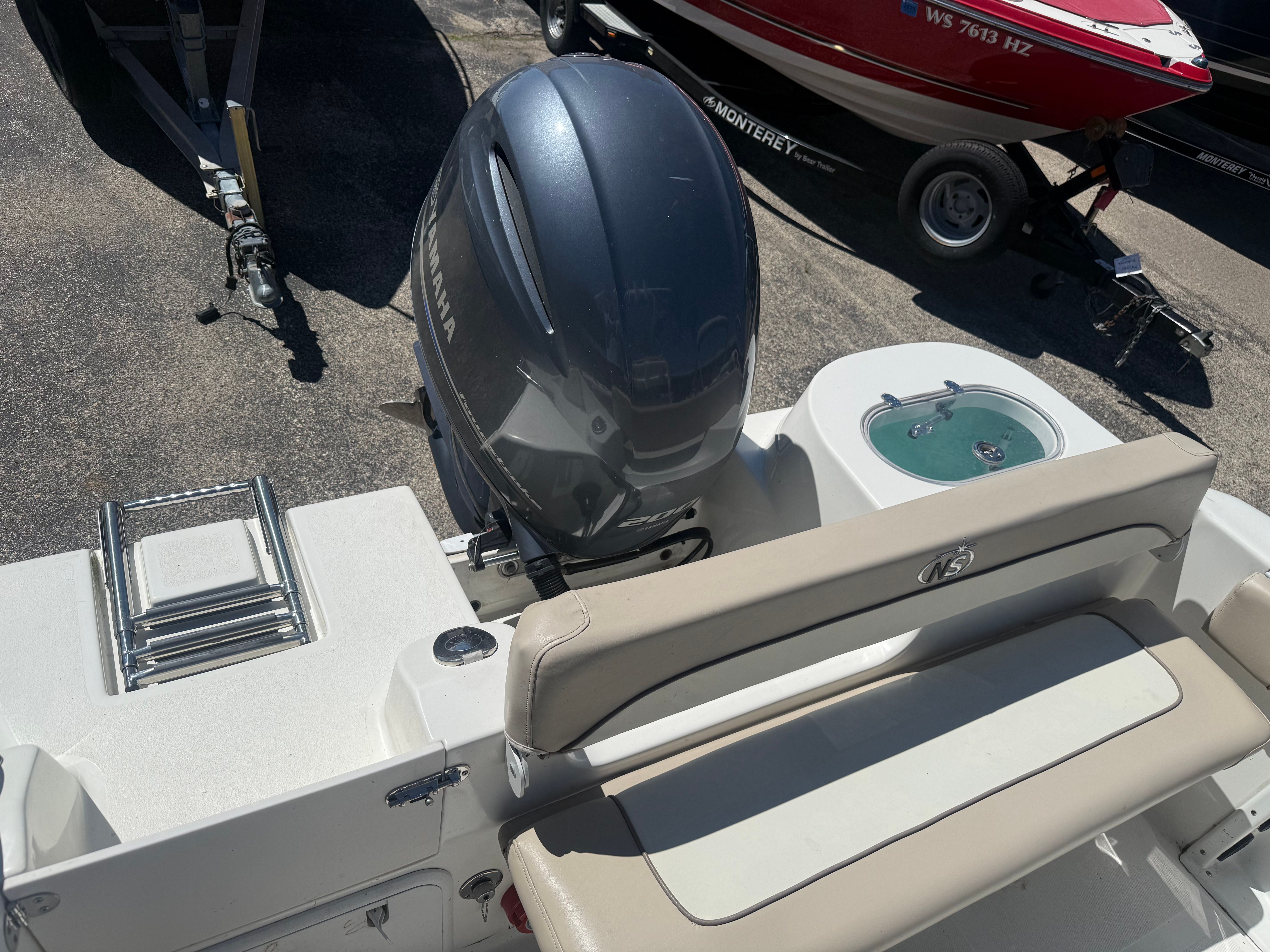 A NauticStar 22 XS boat with Yamaha engine, parked on a trailer.