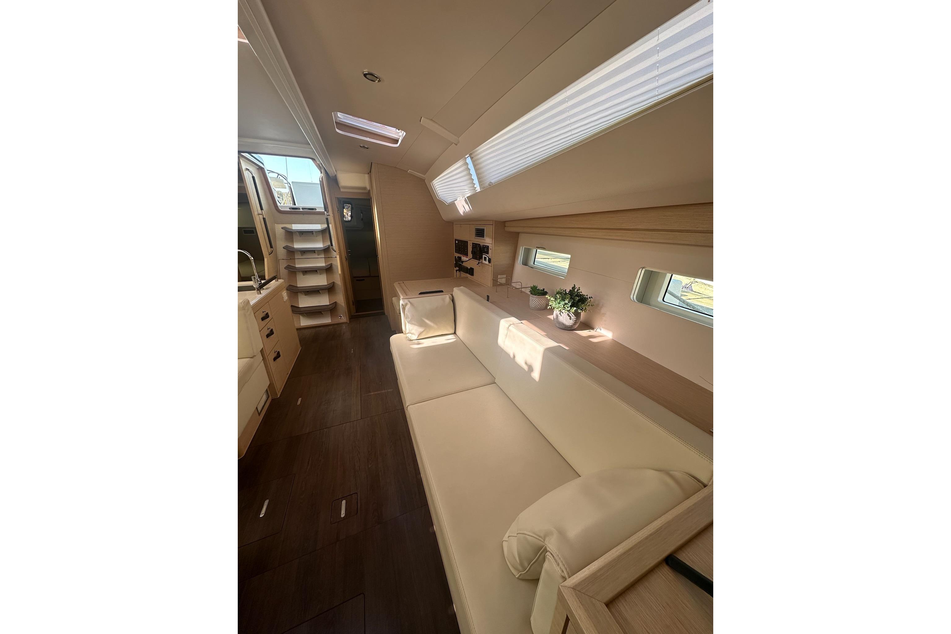 Luxurious interior of a 2018 Jeanneau 51 yacht with elegant seating and modern design.