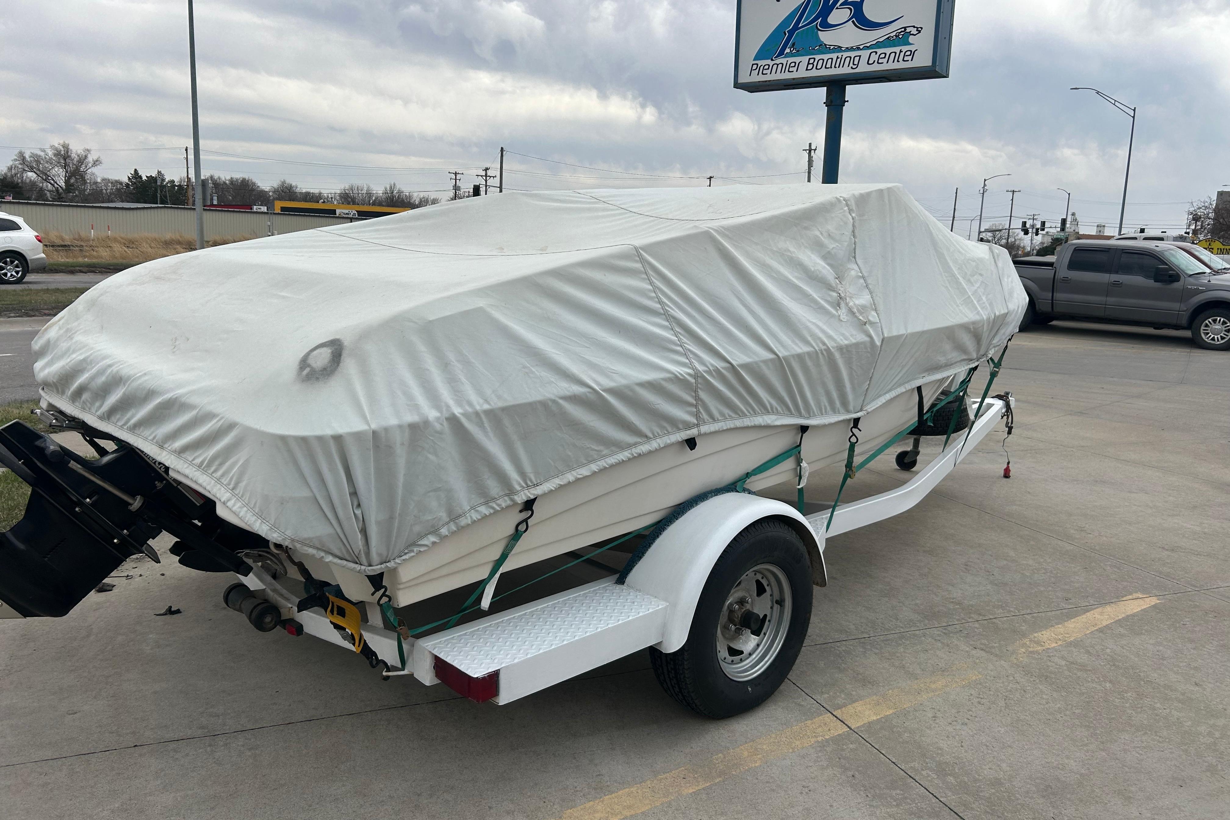 Covered 1996 Mariah 180 Shabah boat on trailer at Premier Boating Center.