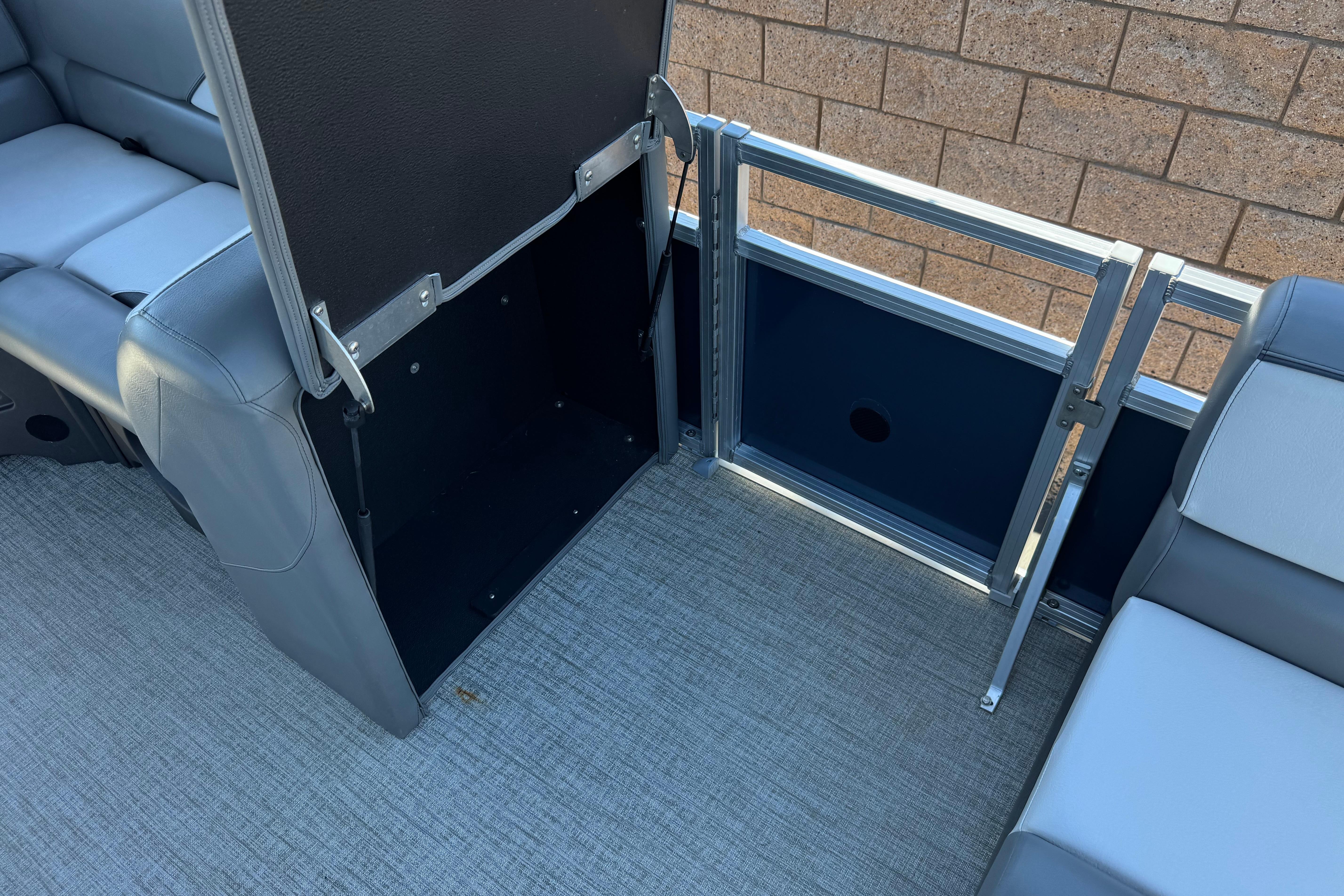 2023 Avalon Venture Fish N Cruise 20' boat interior storage compartment with seating.