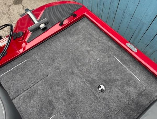 2025 Tracker Savage 215 boat deck with red trim and gray carpet.
