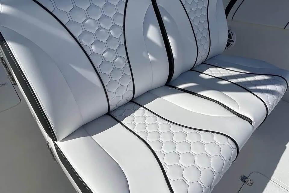 Luxurious white seating with hexagonal pattern on 2009 Midnight Express 34 Open boat.