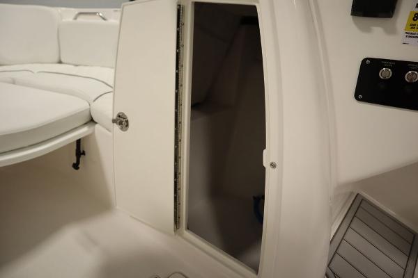 2025 Sea Fox 228 Traveler boat interior with open storage compartment.