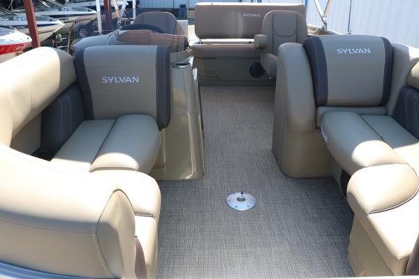 2025 Sylvan Mirage 820 CLZ DH pontoon boat interior with beige seating.