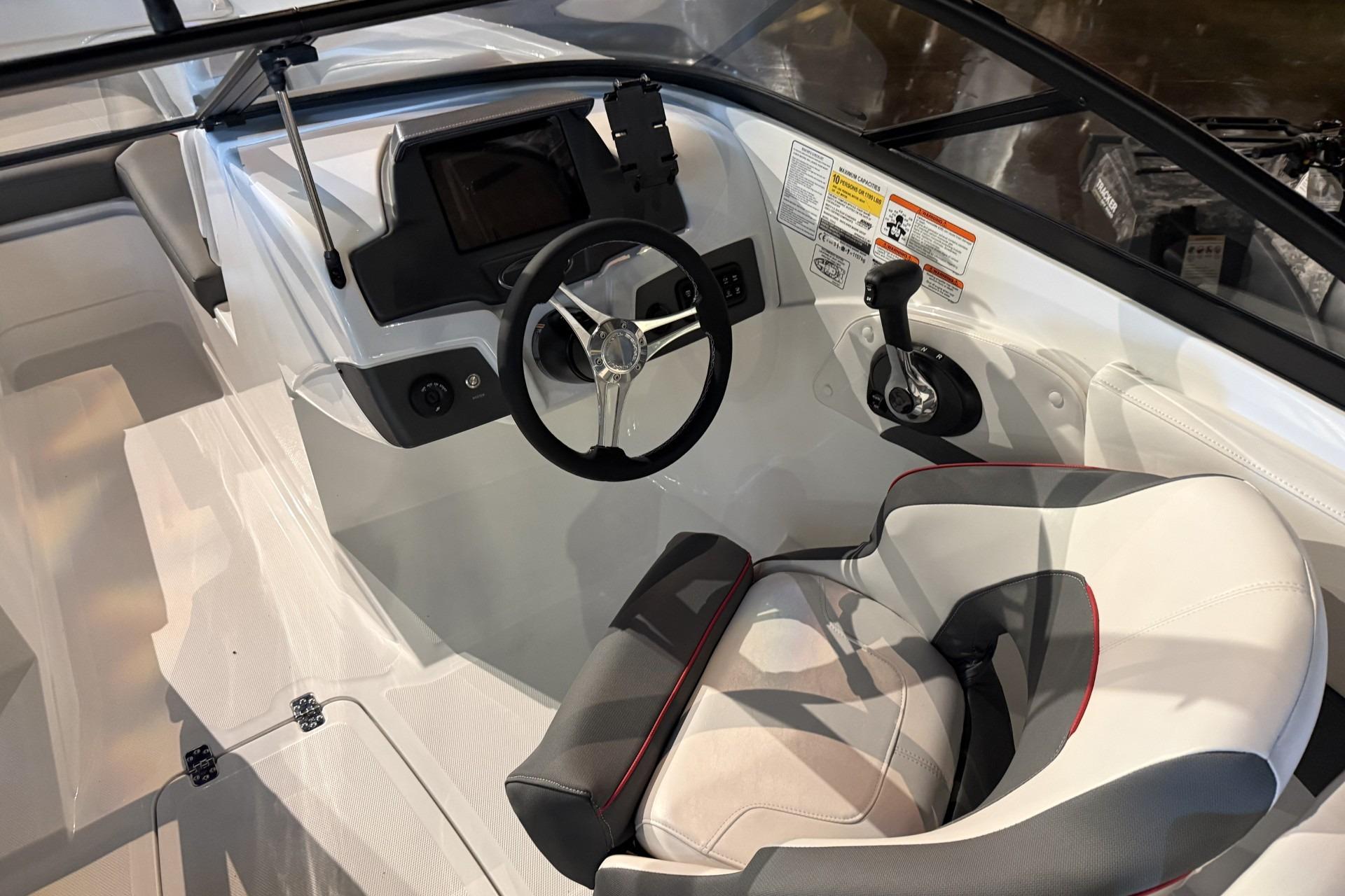 Interior of 2024 Tahoe 210 S boat featuring steering wheel and control panel.