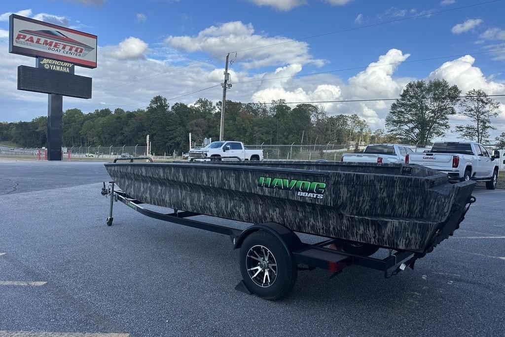 2025 Havoc 1860 boat on trailer at Palmetto Boat Center parking lot.