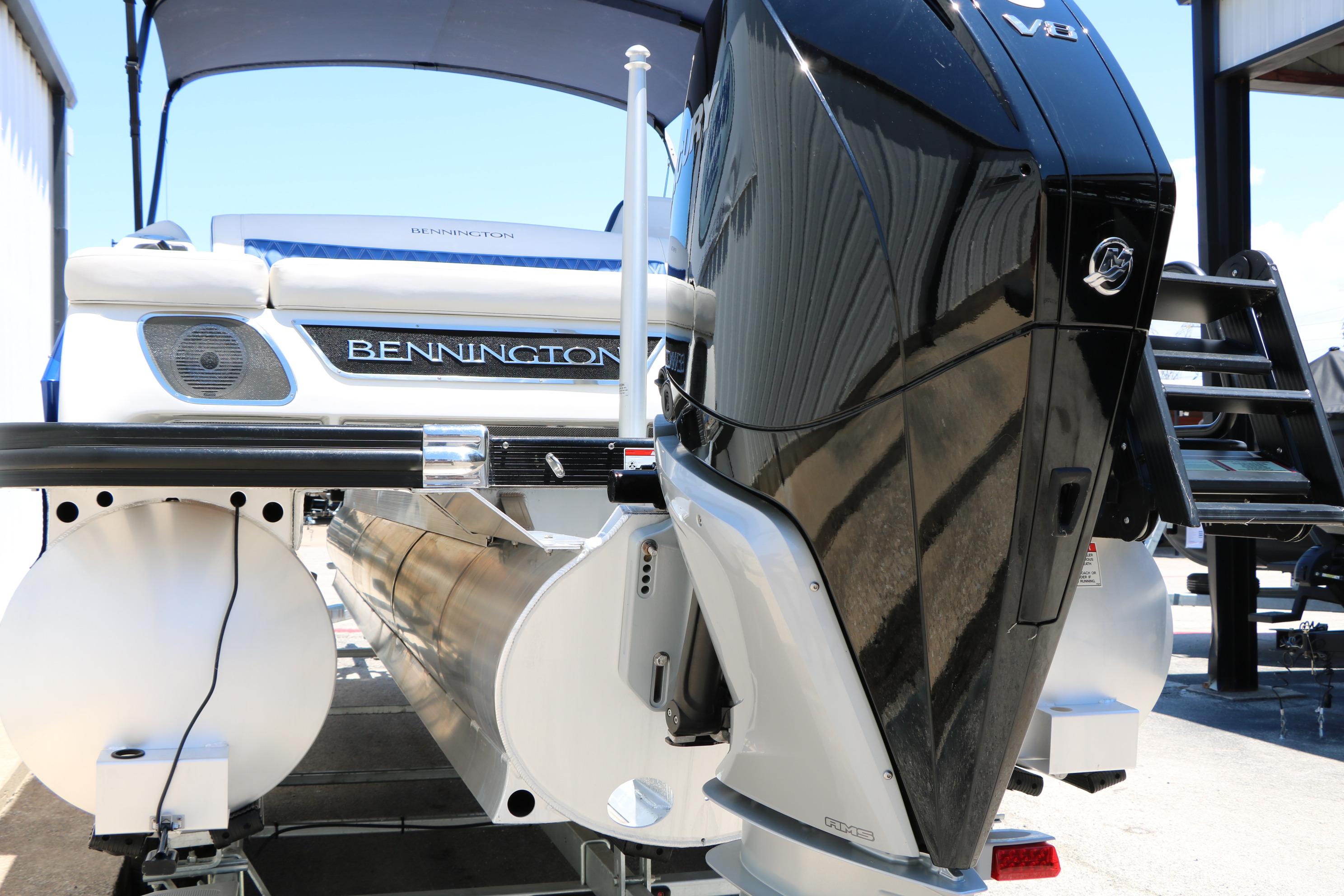 2024 Bennington 23 RX Swingback pontoon boat with powerful outboard motor.
