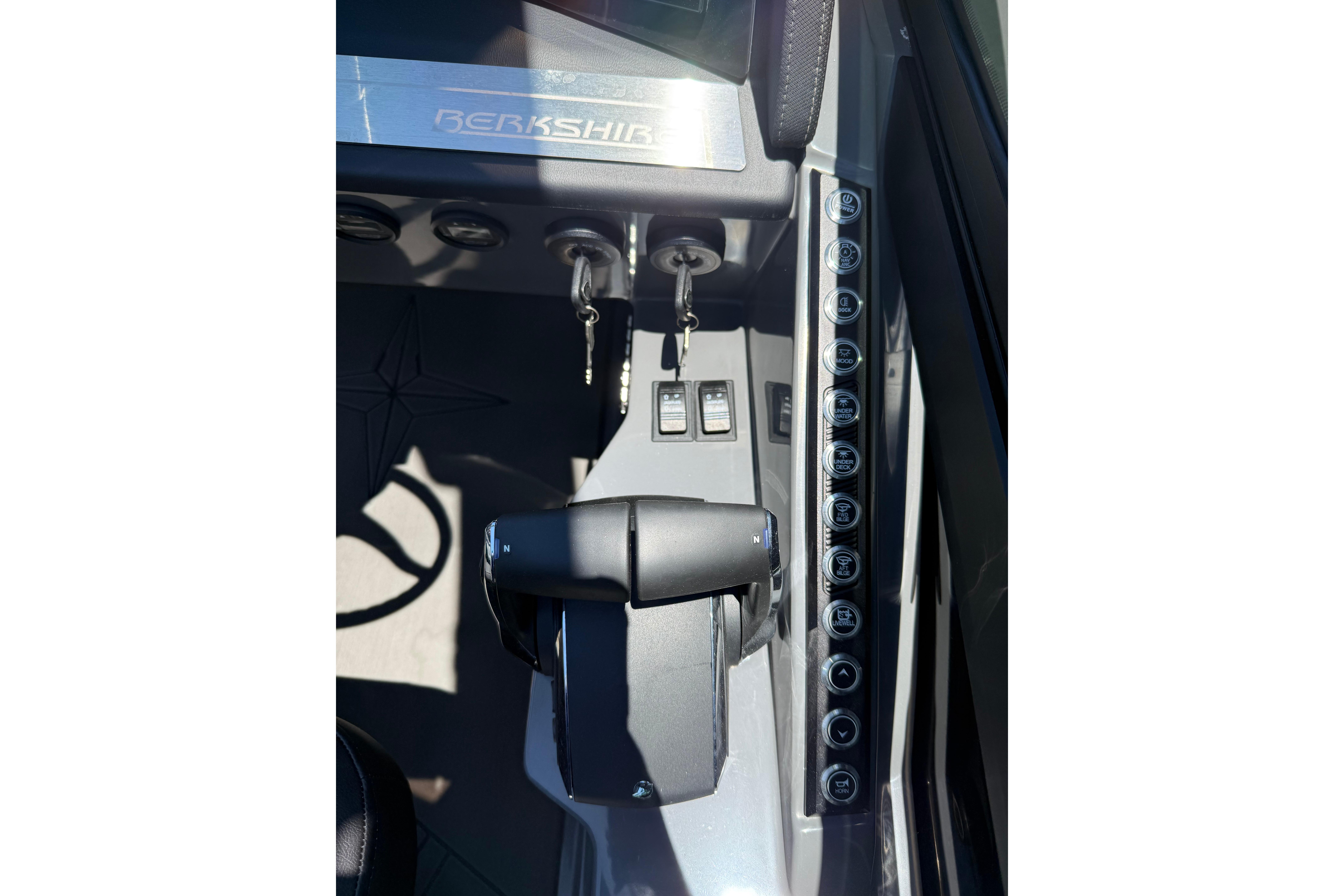 Control panel of 2026 Berkshire Sport SLX9 DC boat with steering and switches.