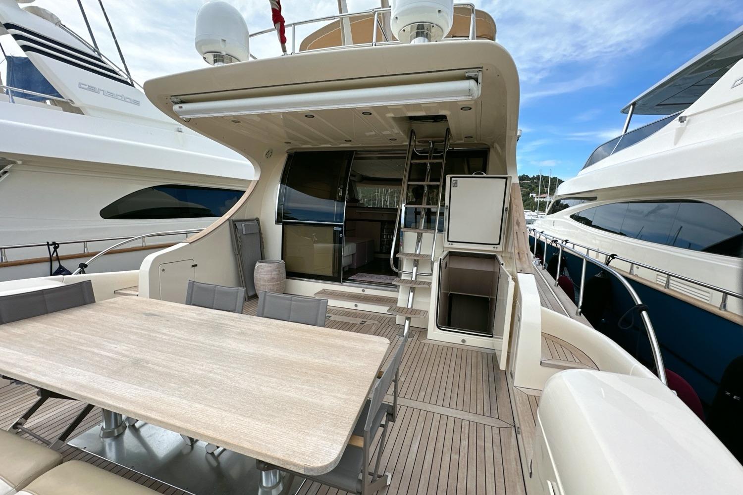 2010 Abati Yachts 64 Freeport luxury yacht with spacious deck and elegant dining area.