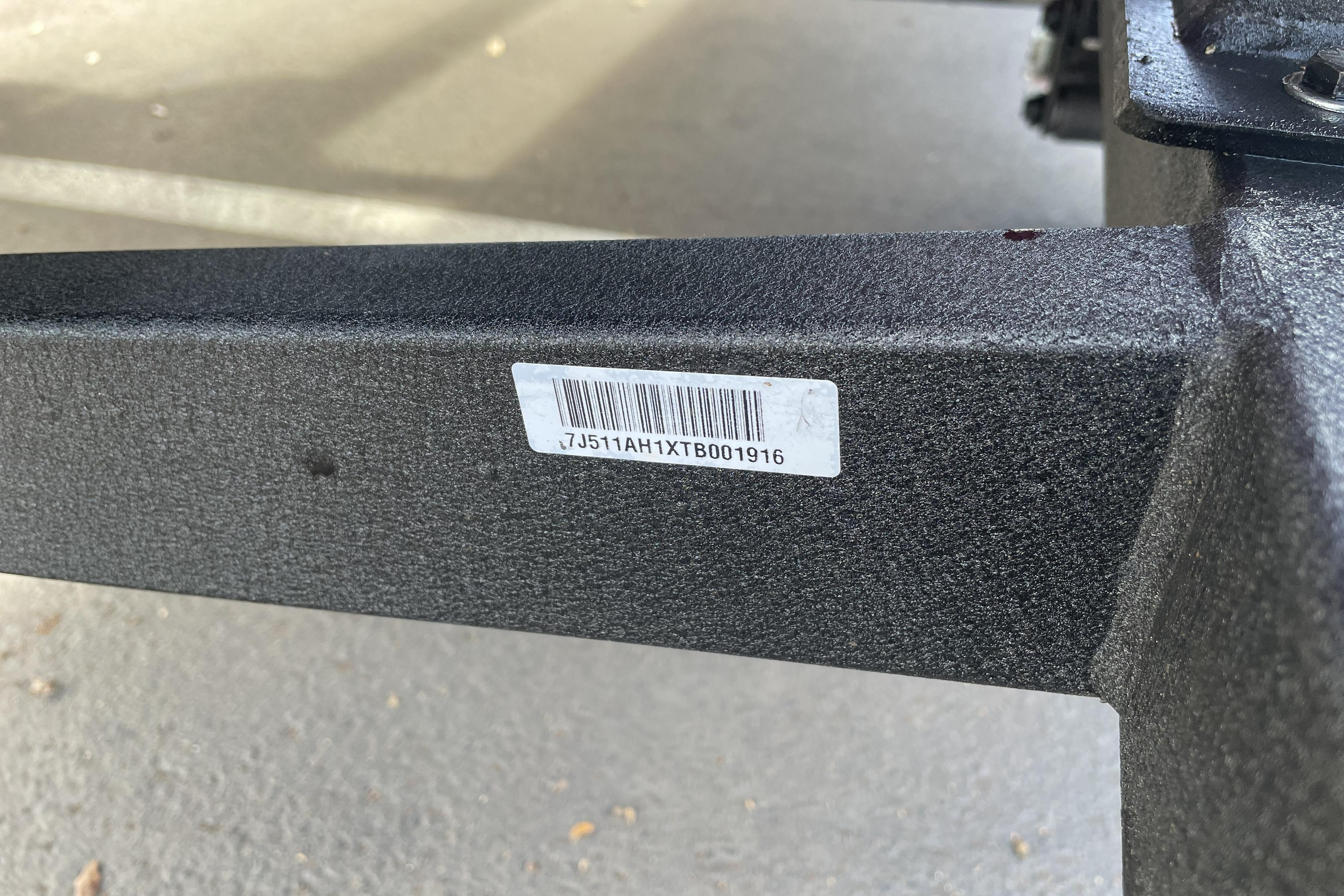 VIN label on 2026 Tracker Bass Tracker Classic XL boat trailer frame.