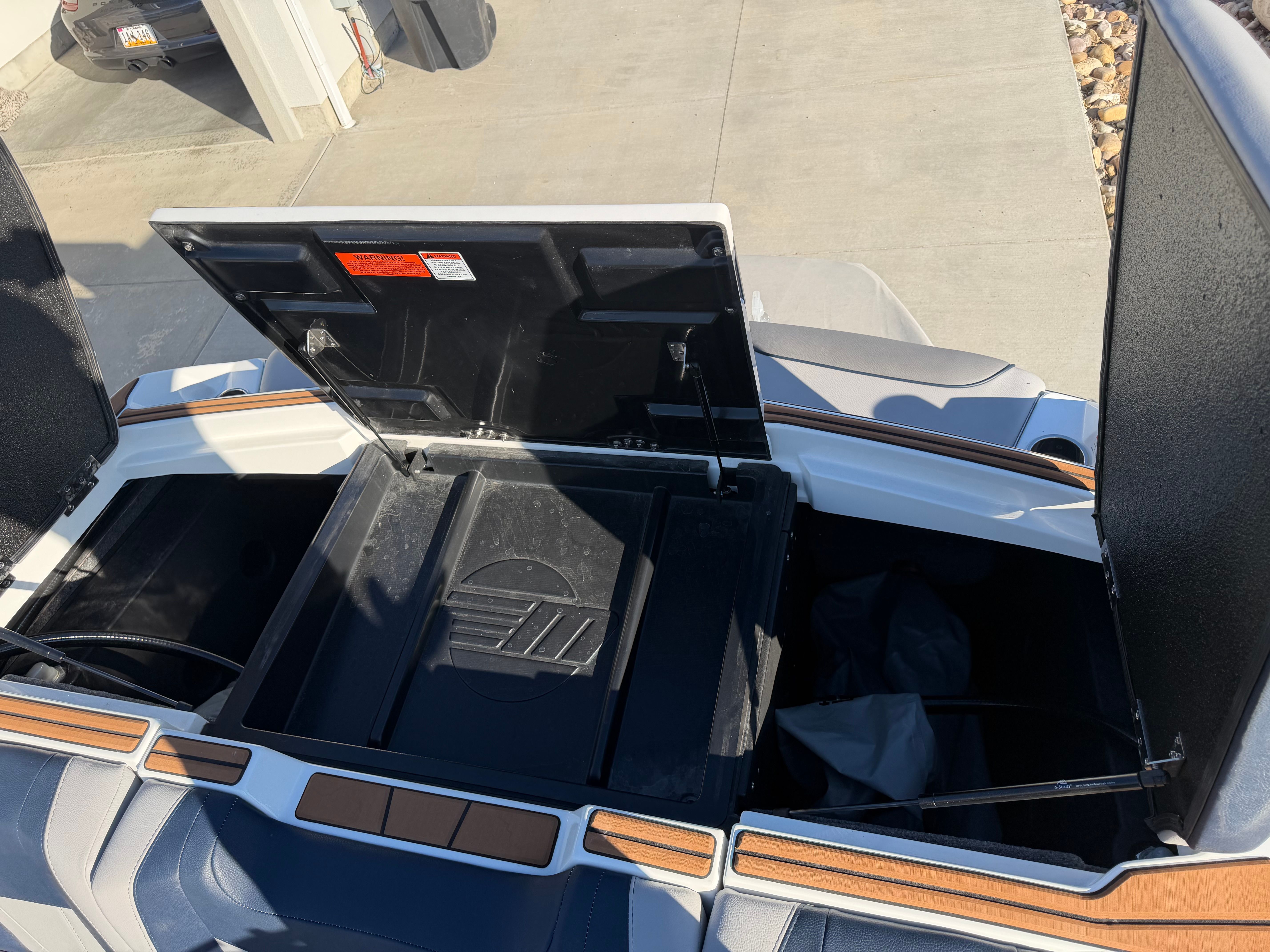 Open storage compartments on a 2021 Malibu Wakesetter 23 LSV.