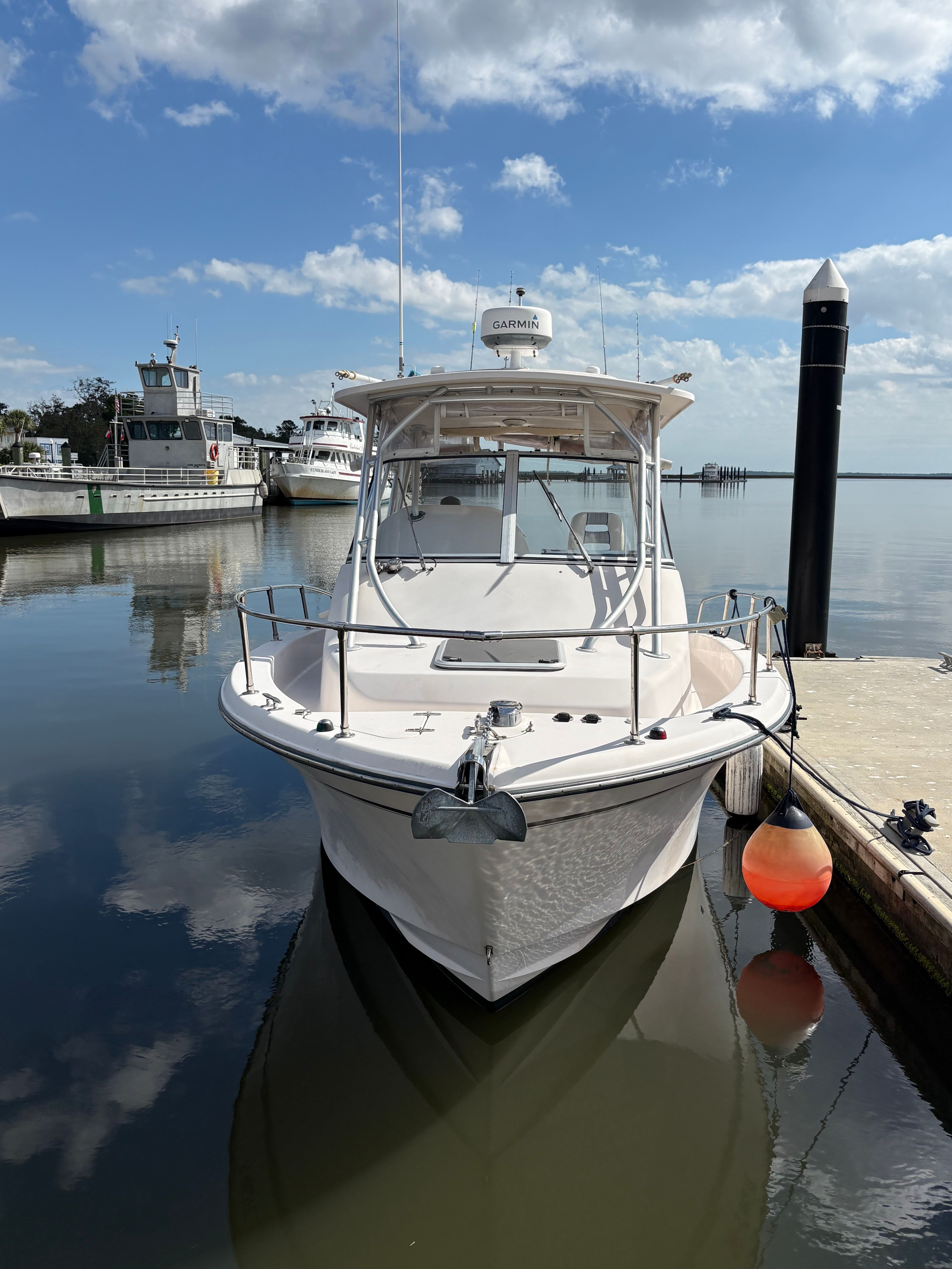 2009 Grady-White Chesapeake 290 boat docked at marina.