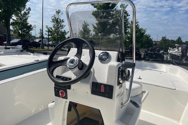 2026 Mako Pro Skiff 17 CC boat console with steering wheel and controls.