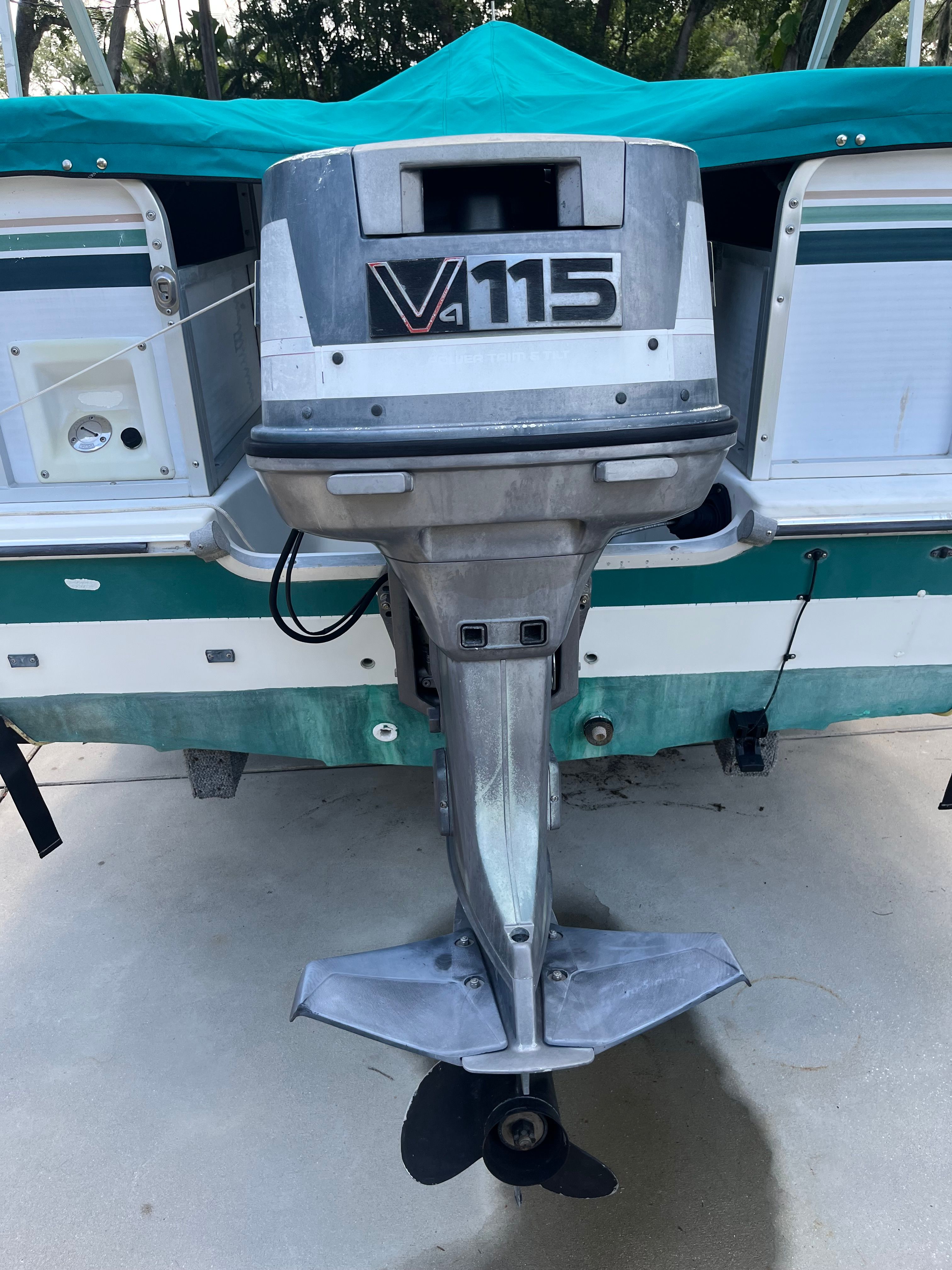 1993 Hurricane Fun Deck boat with V4 115 outboard motor.