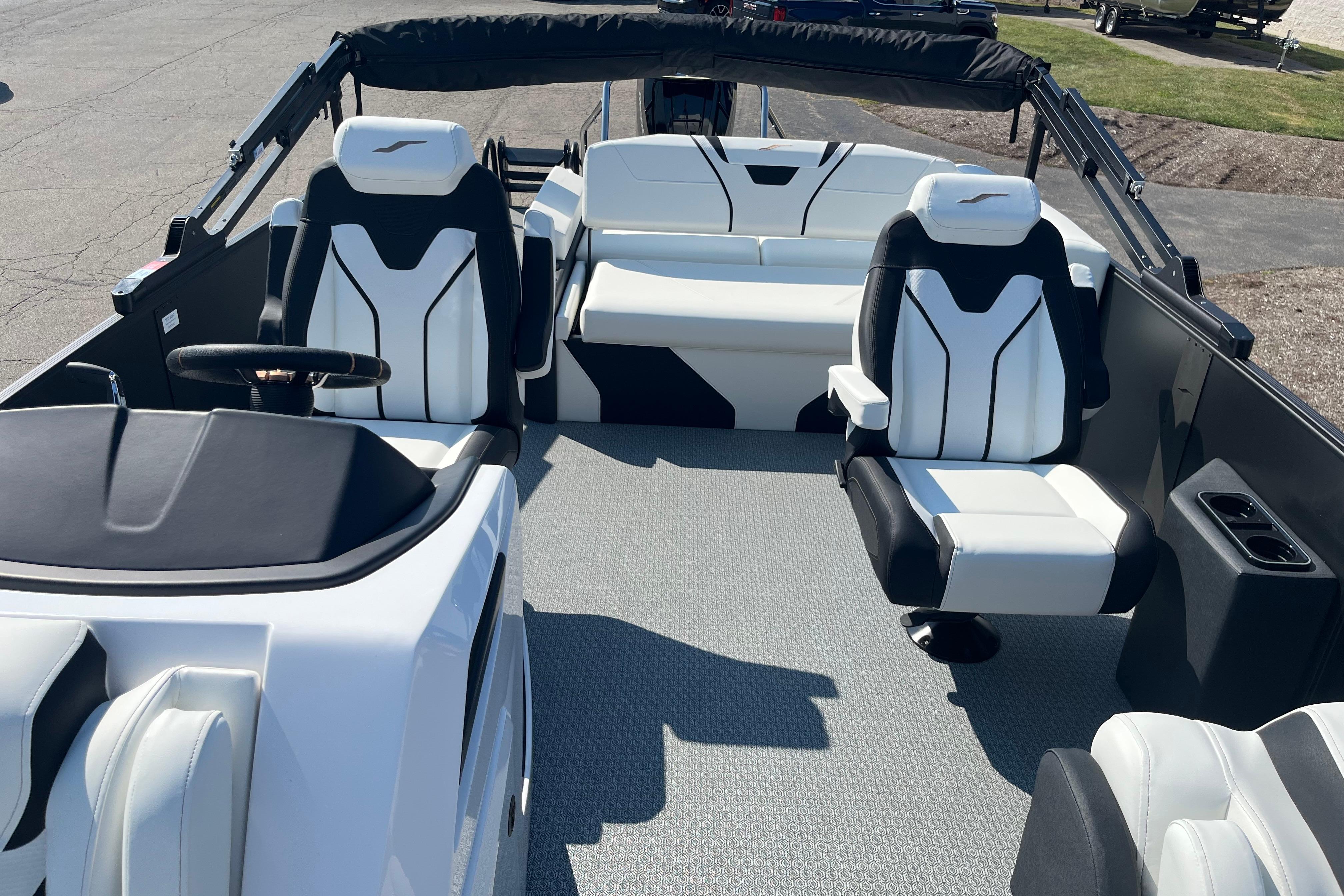 2026 Evotti 725CS boat interior with modern seating and steering wheel.