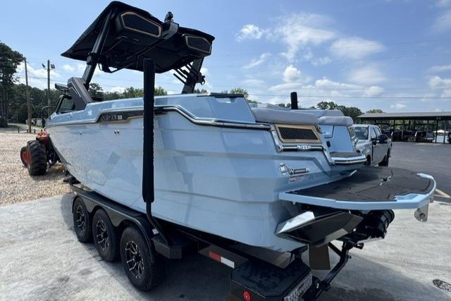 2026 MasterCraft XStar 25 boat on trailer, featuring sleek design and modern amenities.
