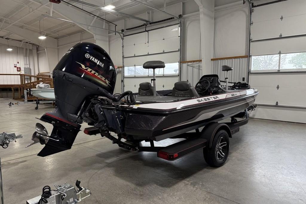 2025 Skeeter ZX150 boat with Yamaha engine in a spacious garage setting.