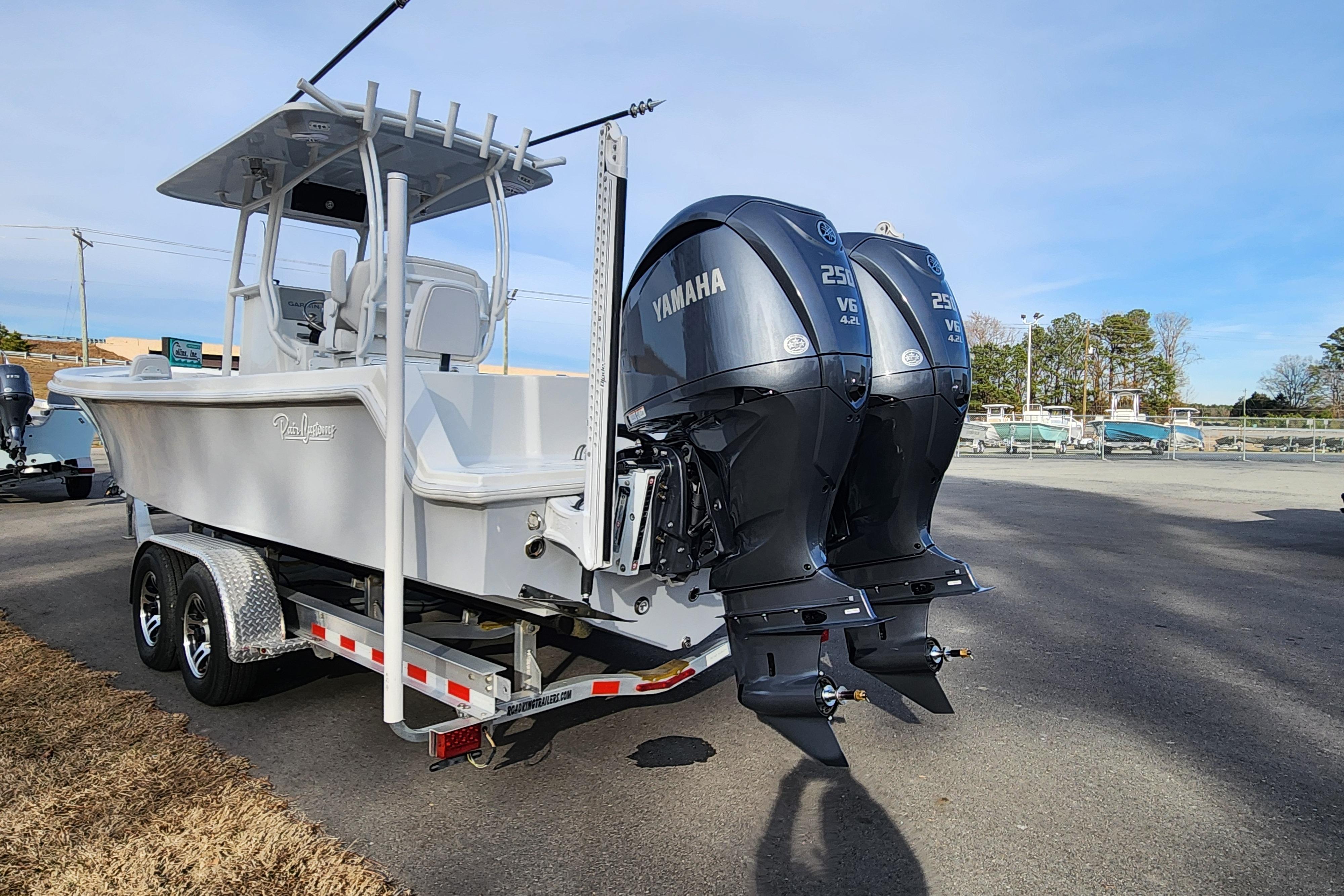 2024 Pair Customs 27 CC boat with dual Yamaha 250 V6 engines on a trailer.