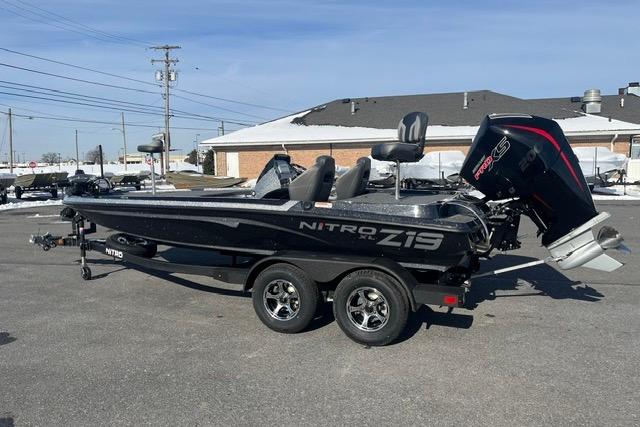 2026 Nitro Z19 XL Pro boat with trailer, parked outdoors on a sunny day.