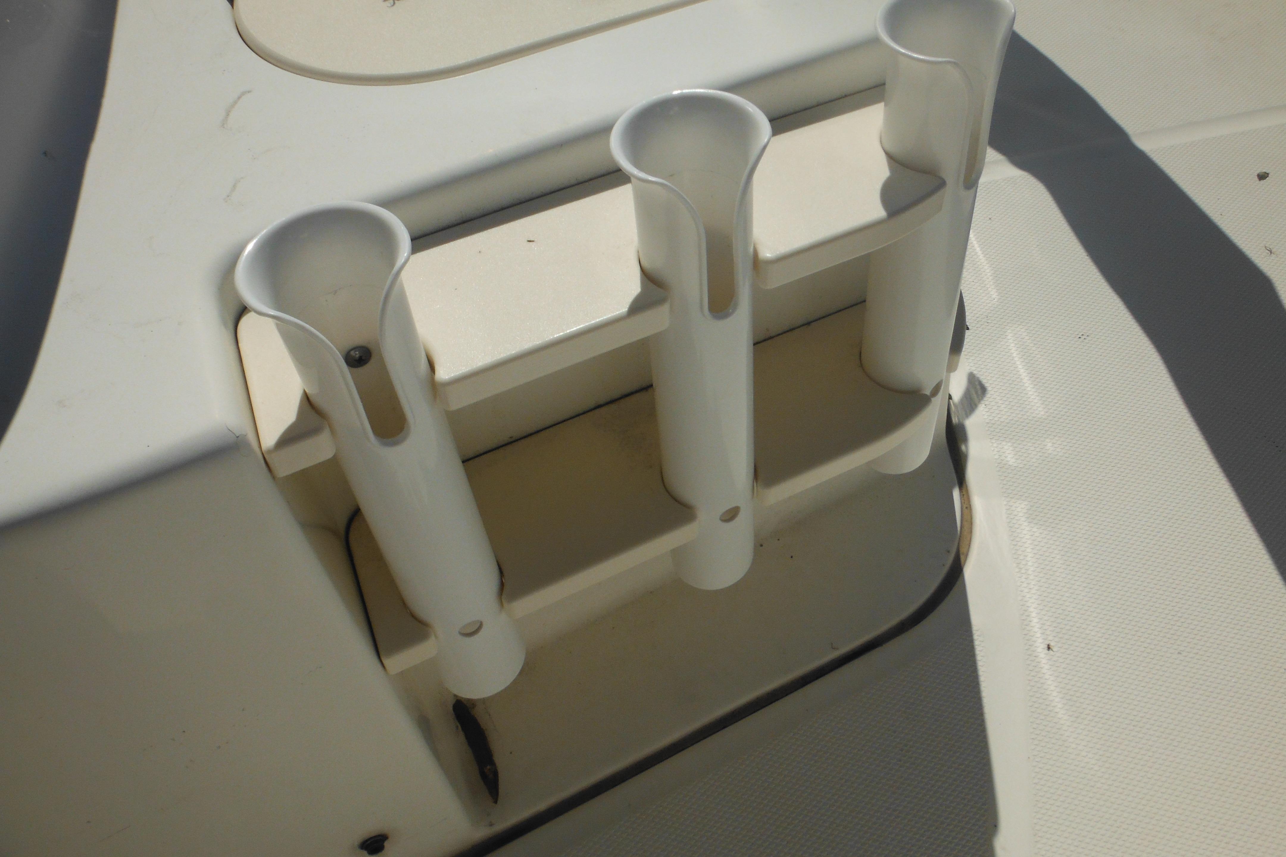 Rod holders on a 2009 Boston Whaler 200 Dauntless boat deck.