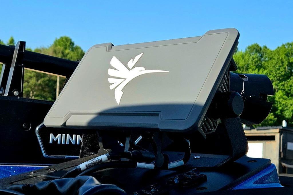 2026 Skeeter ZXE20 boat console with hummingbird logo, outdoors in sunny setting.