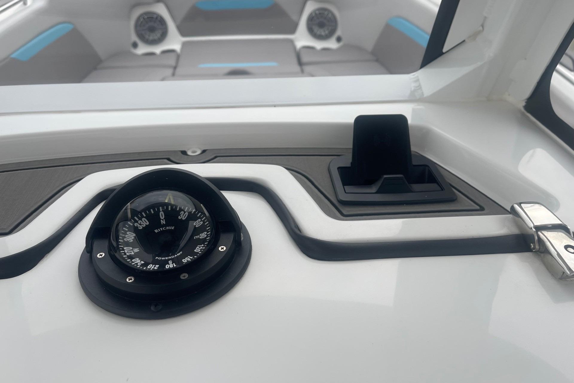 Compass and dashboard of 2025 Hurricane Center Console 24 OB boat.