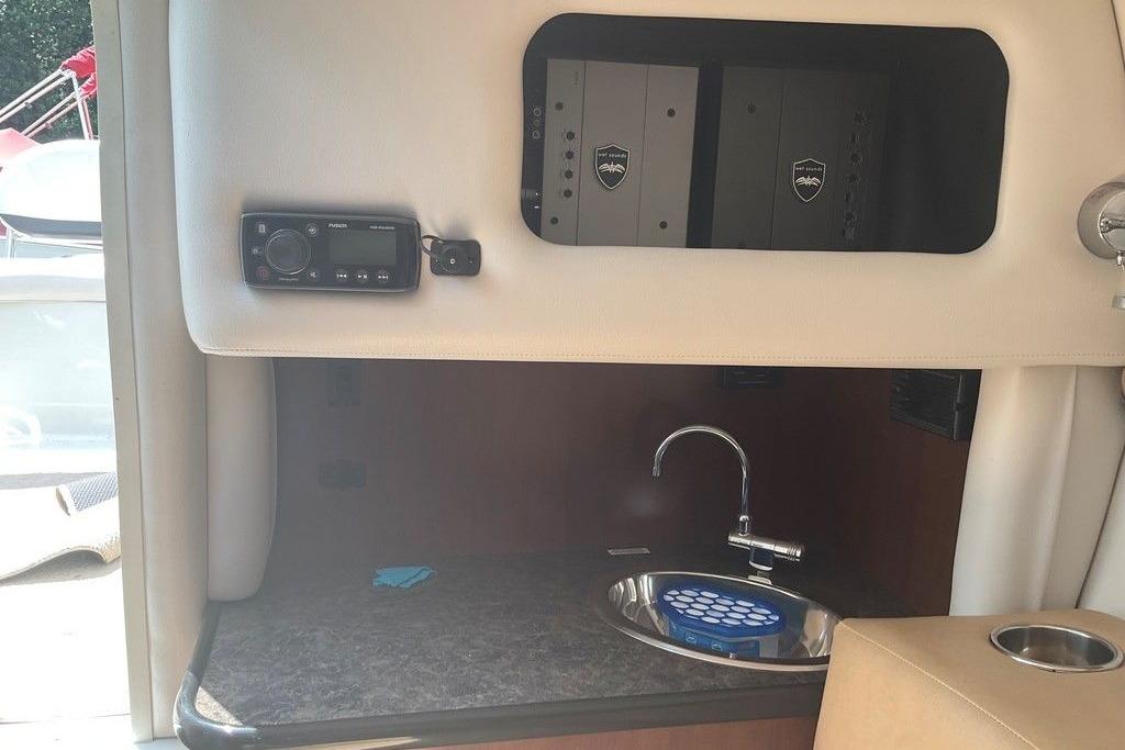 2015 Crownline 236 SC boat interior with sink and control panel.