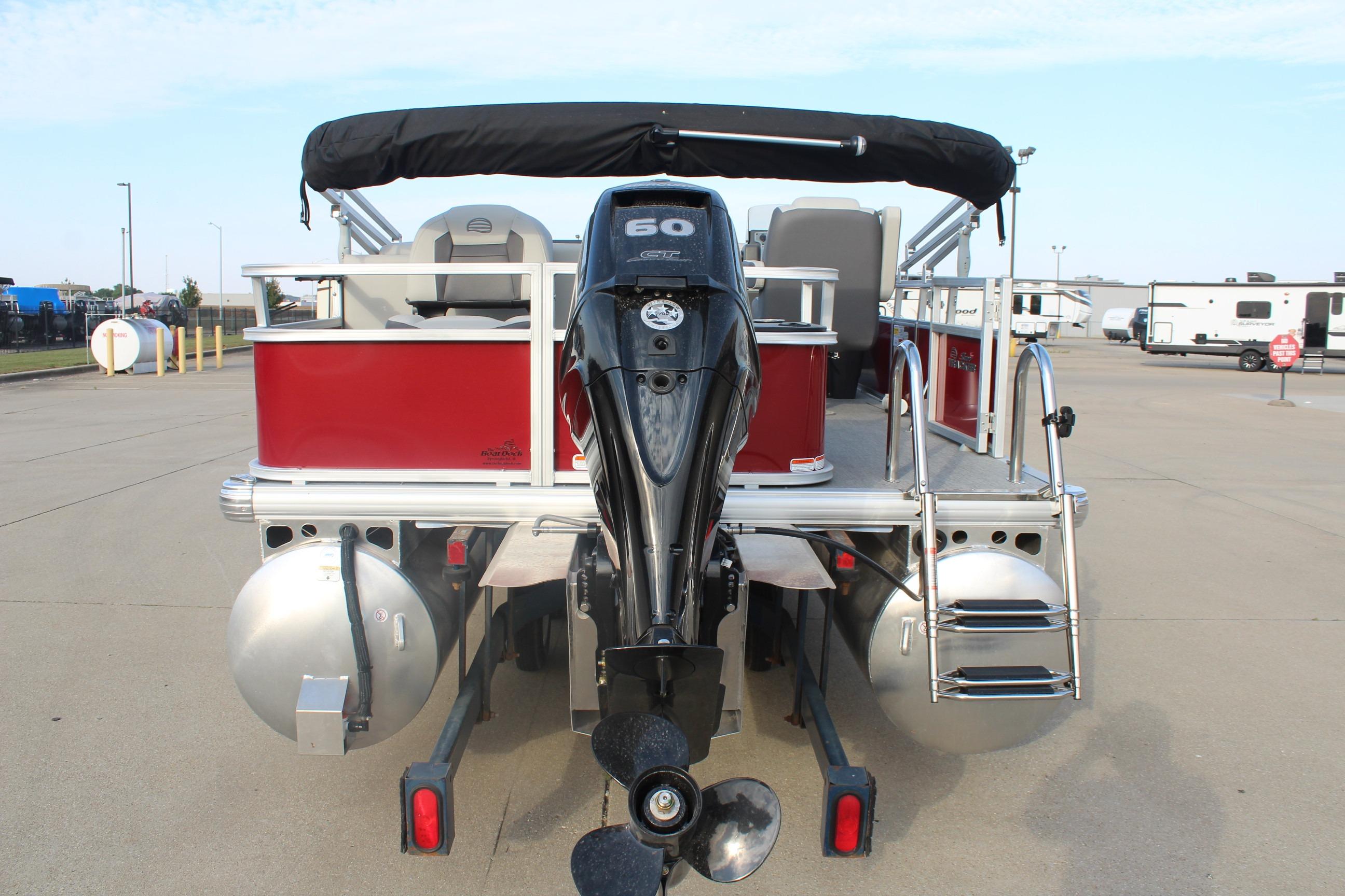 2026 Sun Tracker Bass Buggy 18 DLX pontoon boat with outboard motor, rear view.