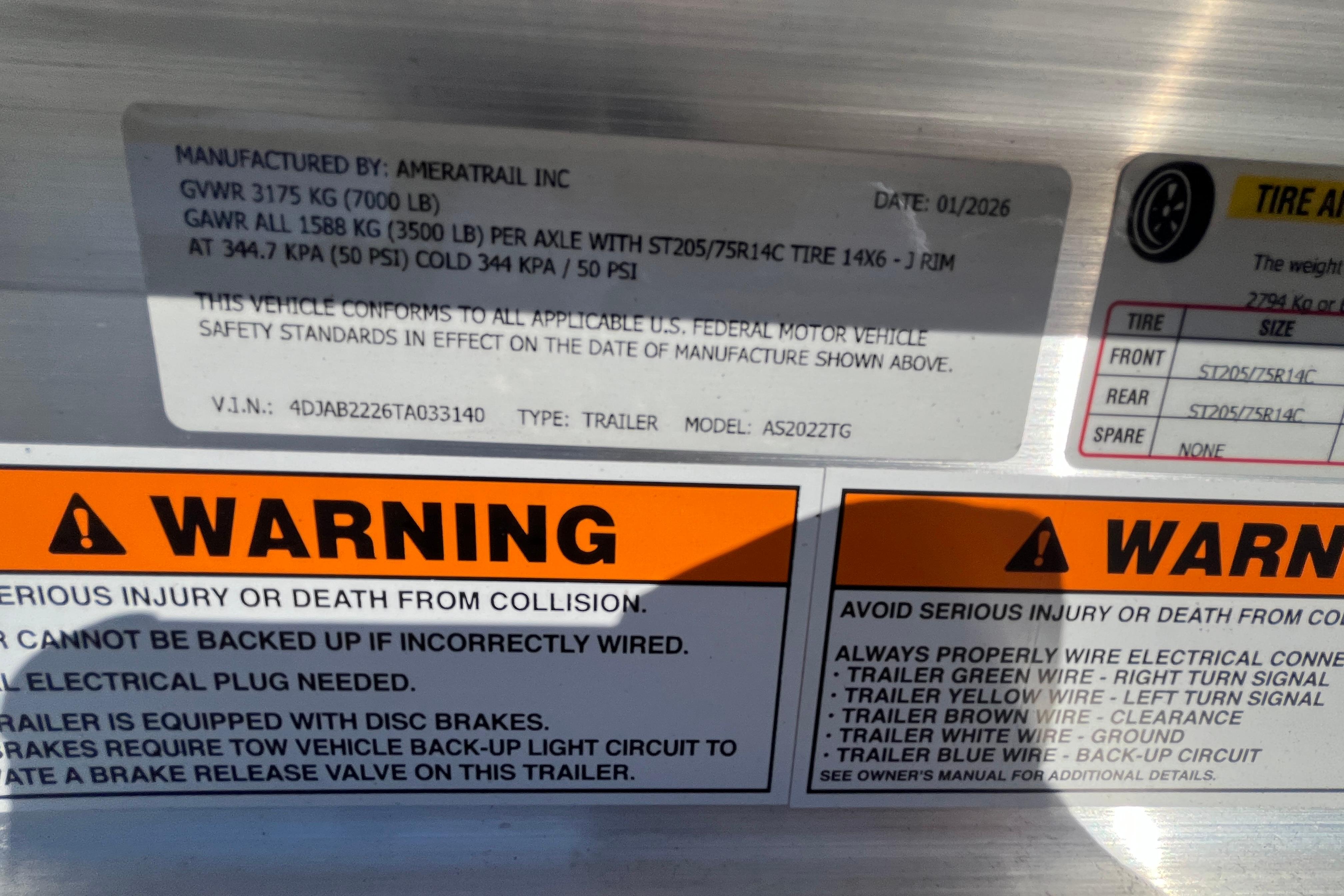 Warning labels and specifications on a 2026 Bulls Bay 2200 trailer.