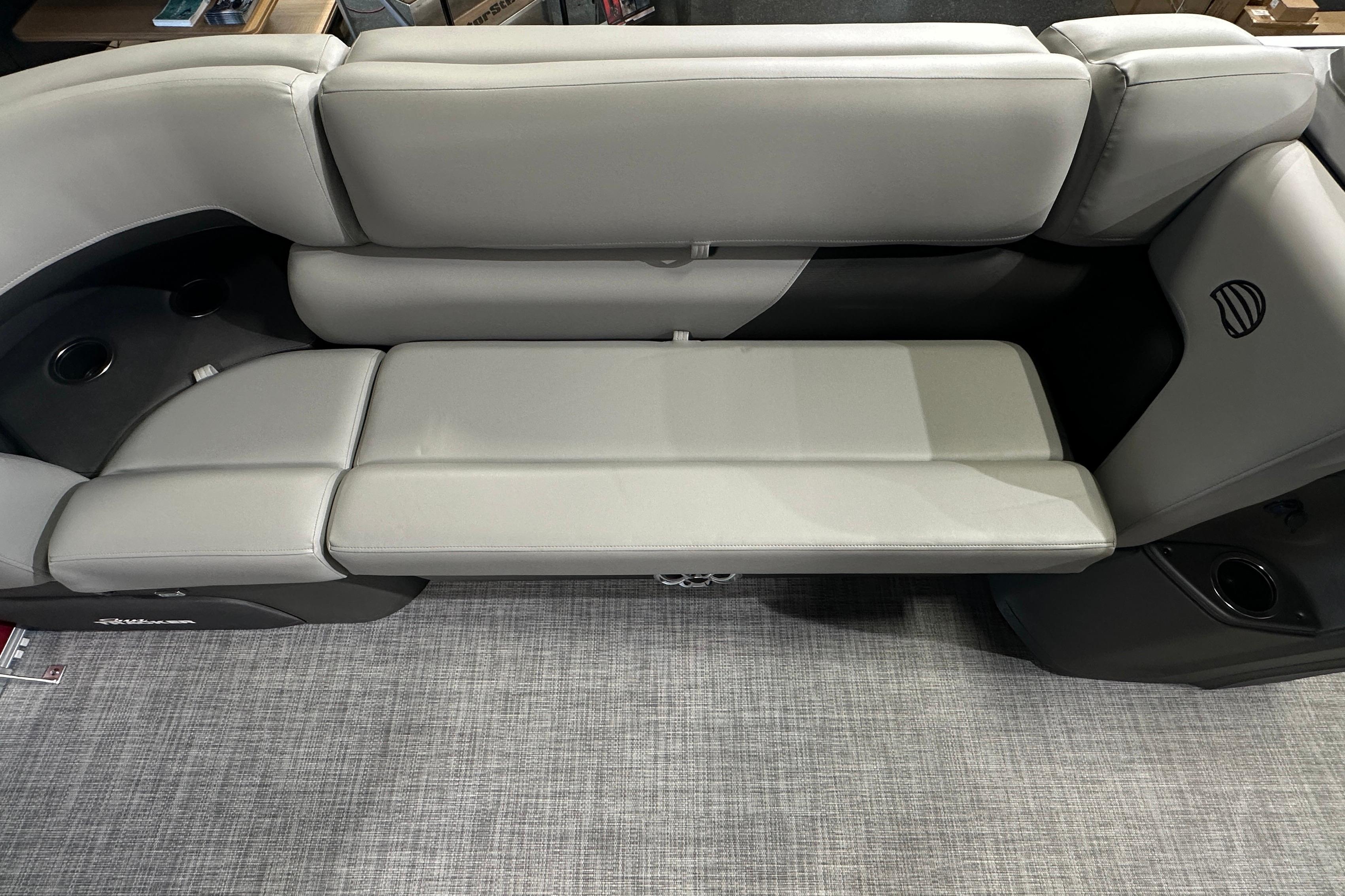 2026 Sun Tracker SportFish 22 DLX boat interior with gray cushioned seating.