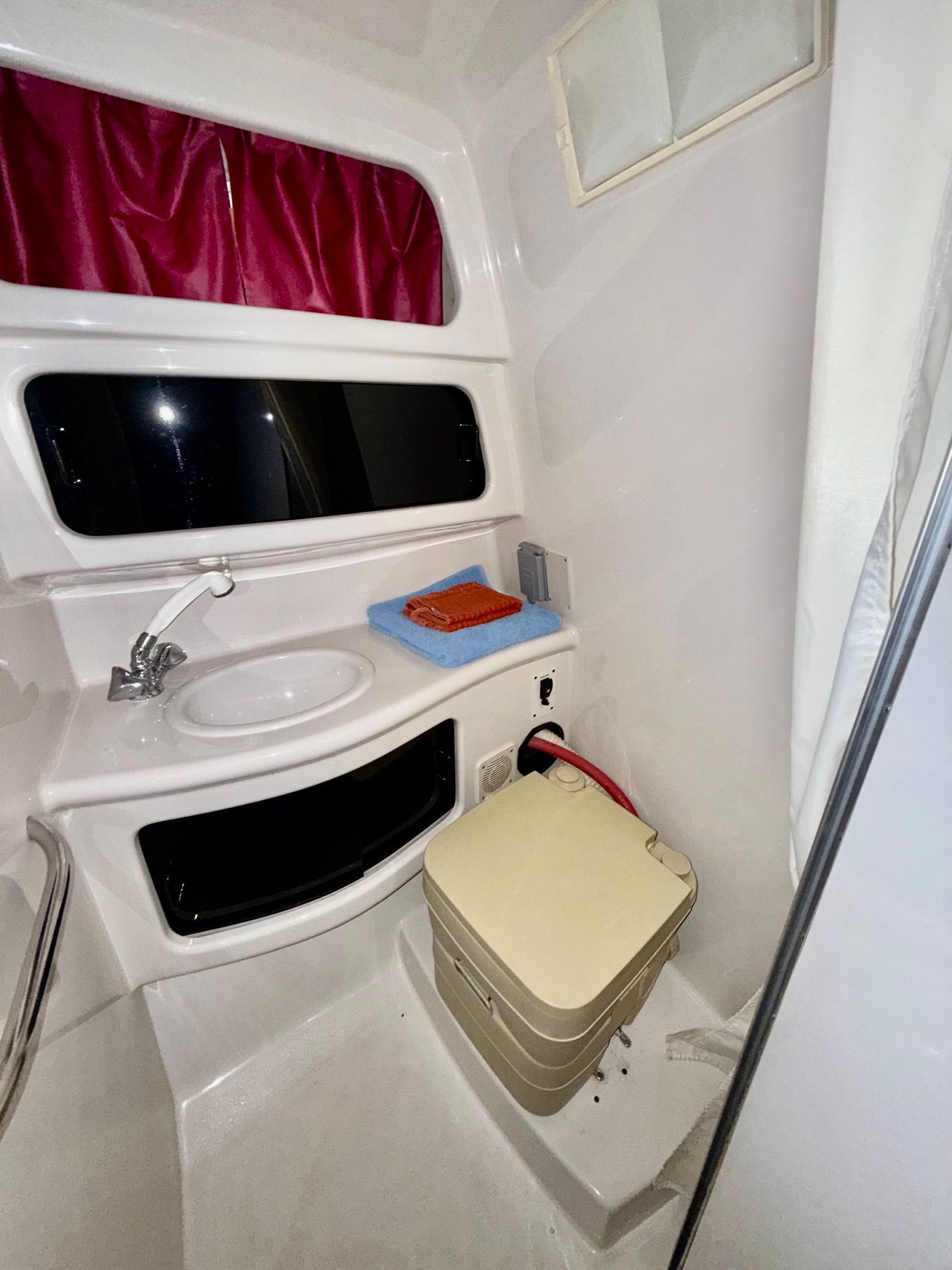 The image shows the bathroom of a 1997 Chaparral Signature 260 with a sink and toilet.